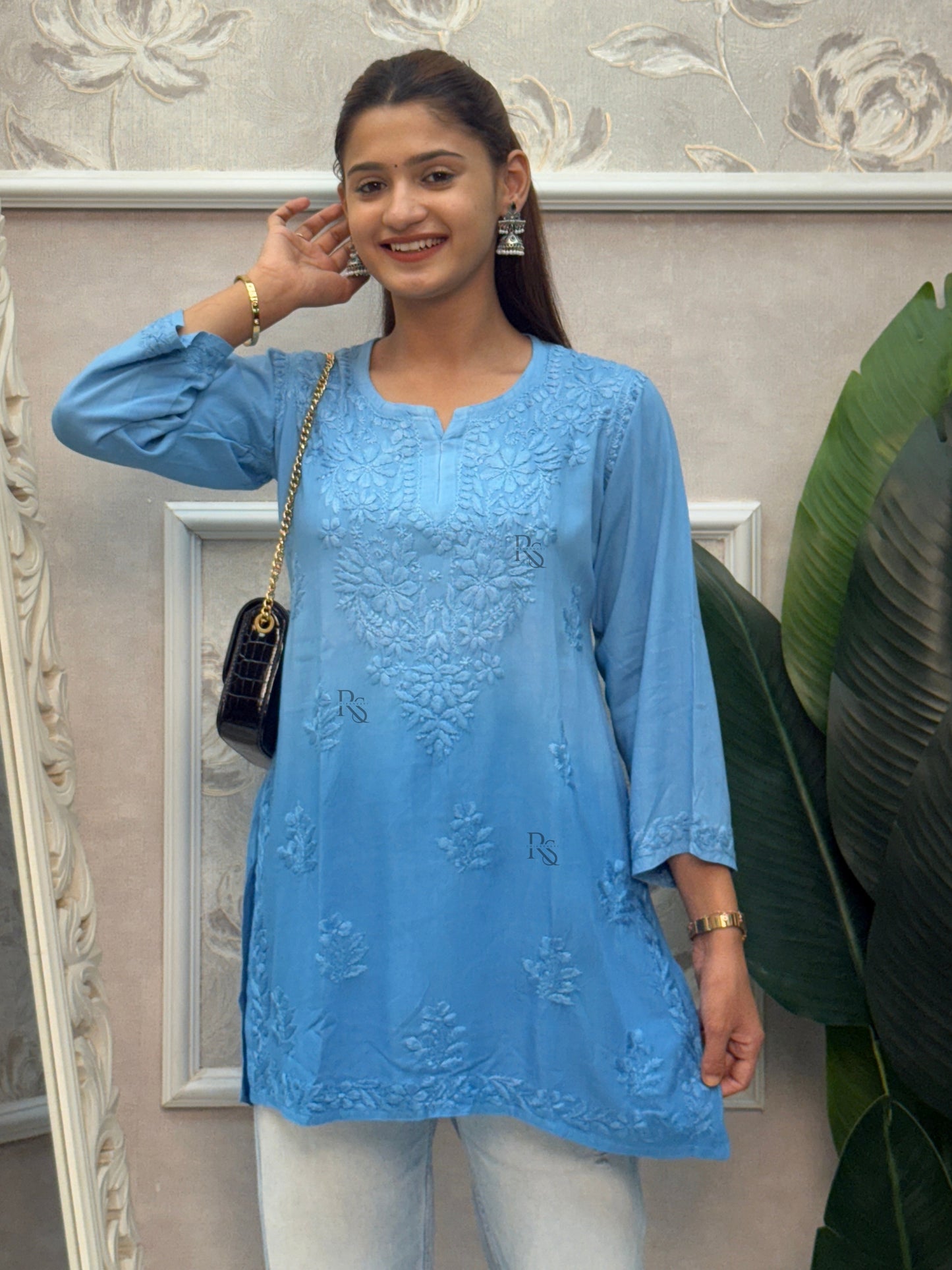 Blue rayon Lucknow Chikankari short kurta with delicate hand embroidery.