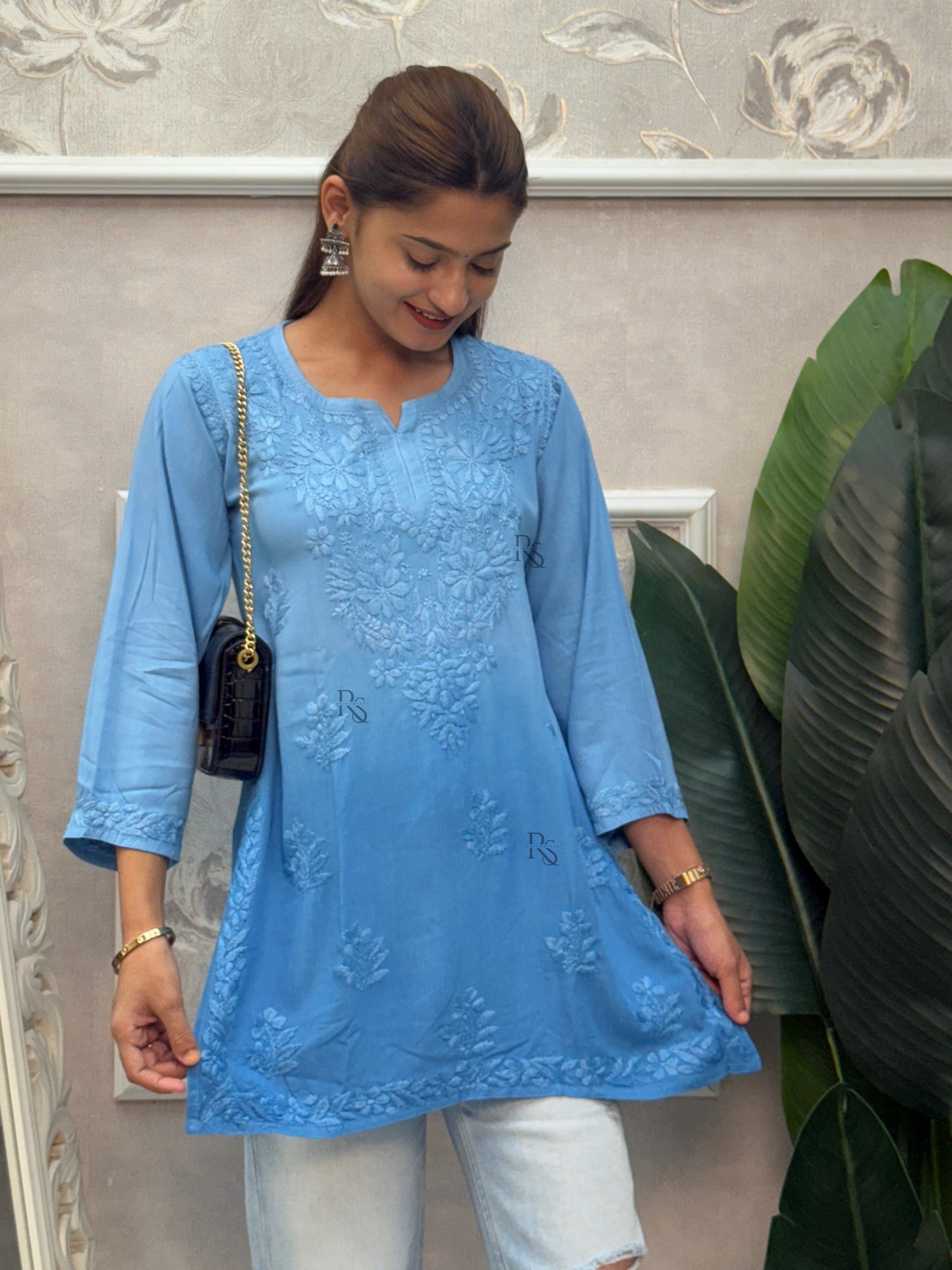 Blue rayon Lucknow Chikankari short kurta with delicate hand embroidery.
