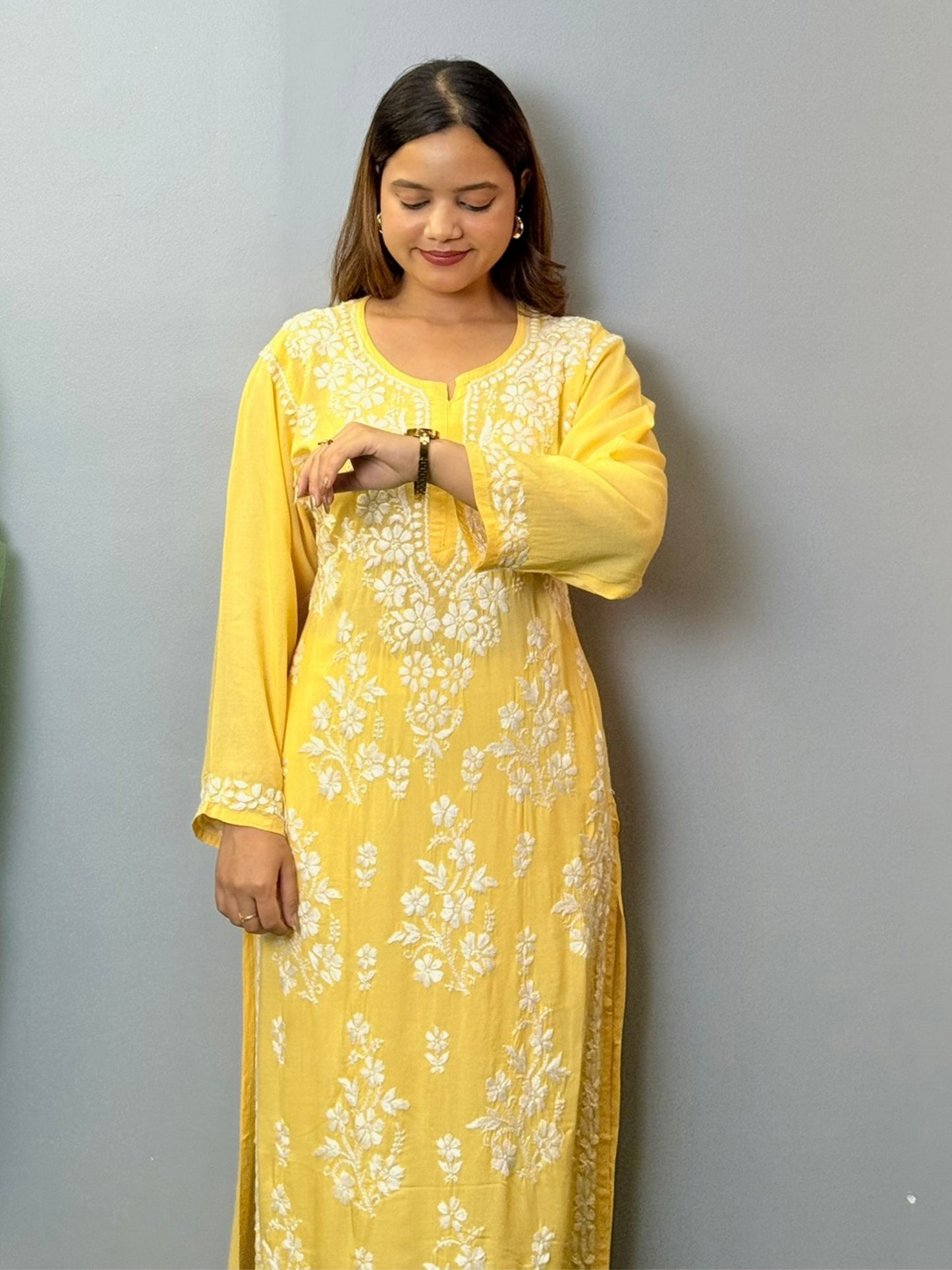 Sunshine yellow modal chikankari kurta with white floral hand embroidery on front and sleeves