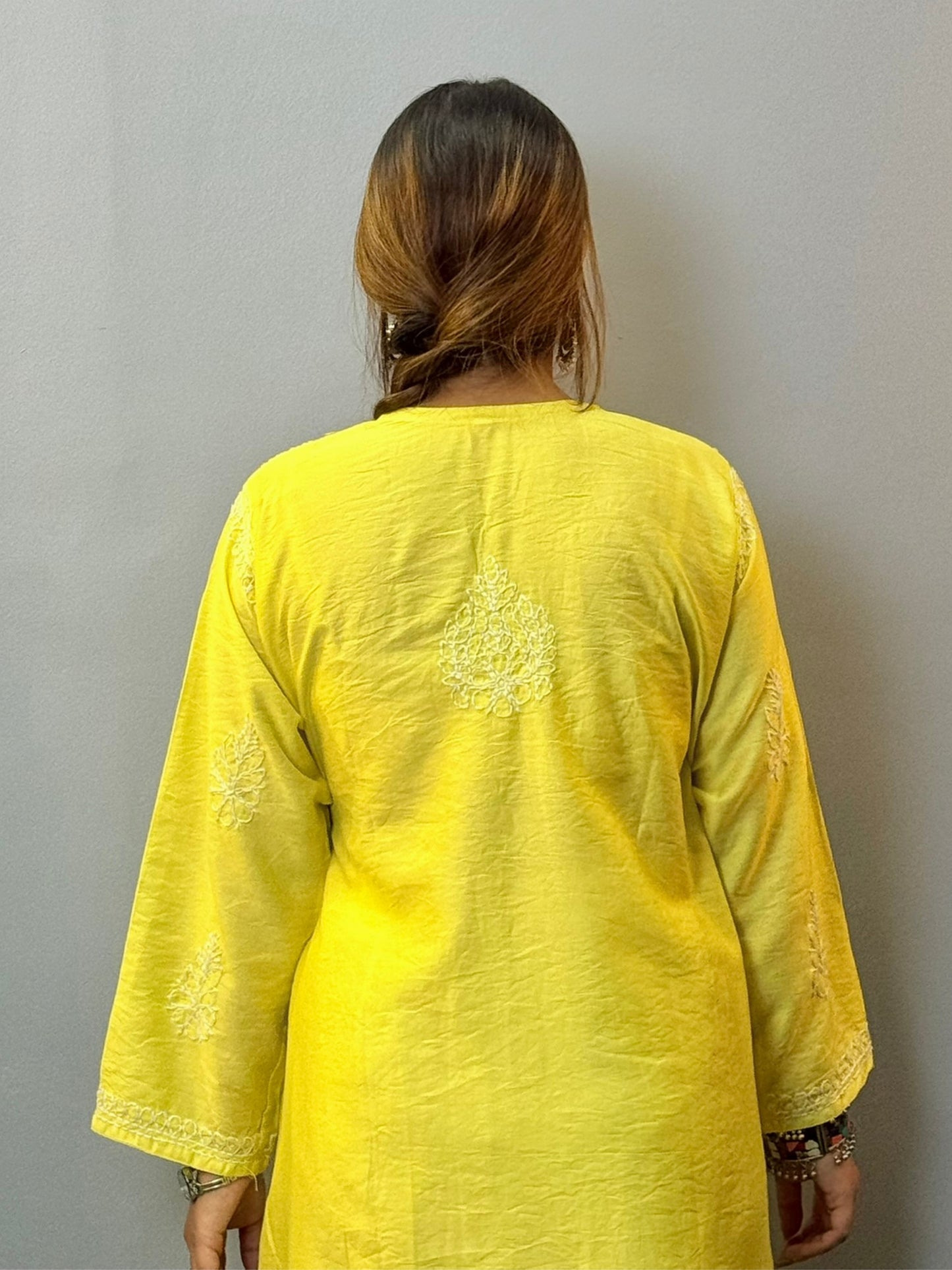 Woman wearing lime yellow chanderi chikankari kurta with bakhiya embroidery