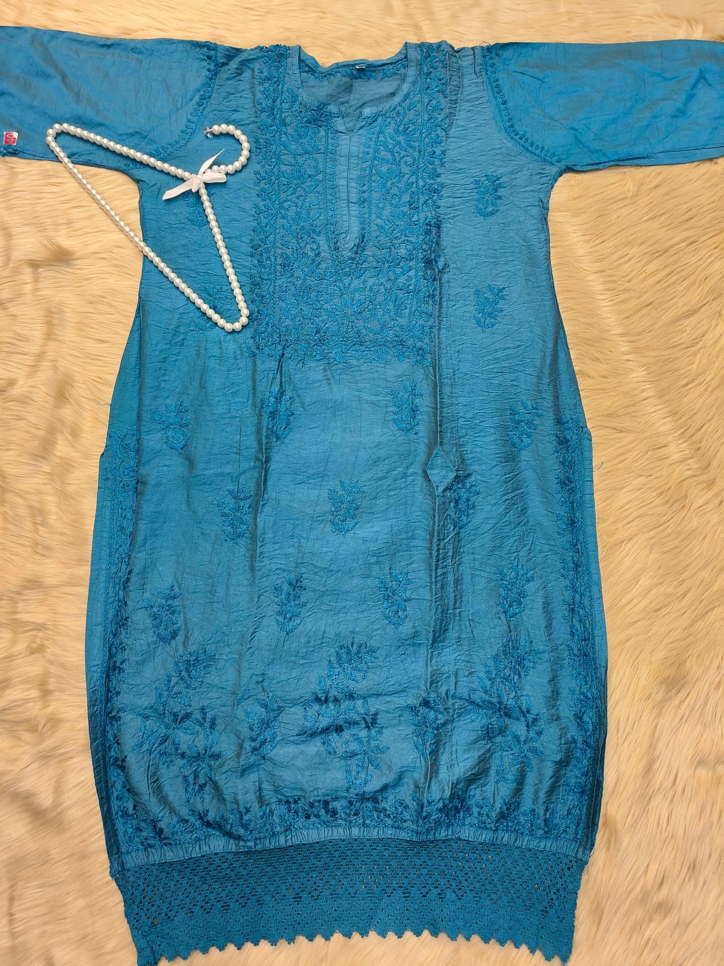 Peacock blue chanderi chikankari kurta with detailed hand embroidery and lace finish