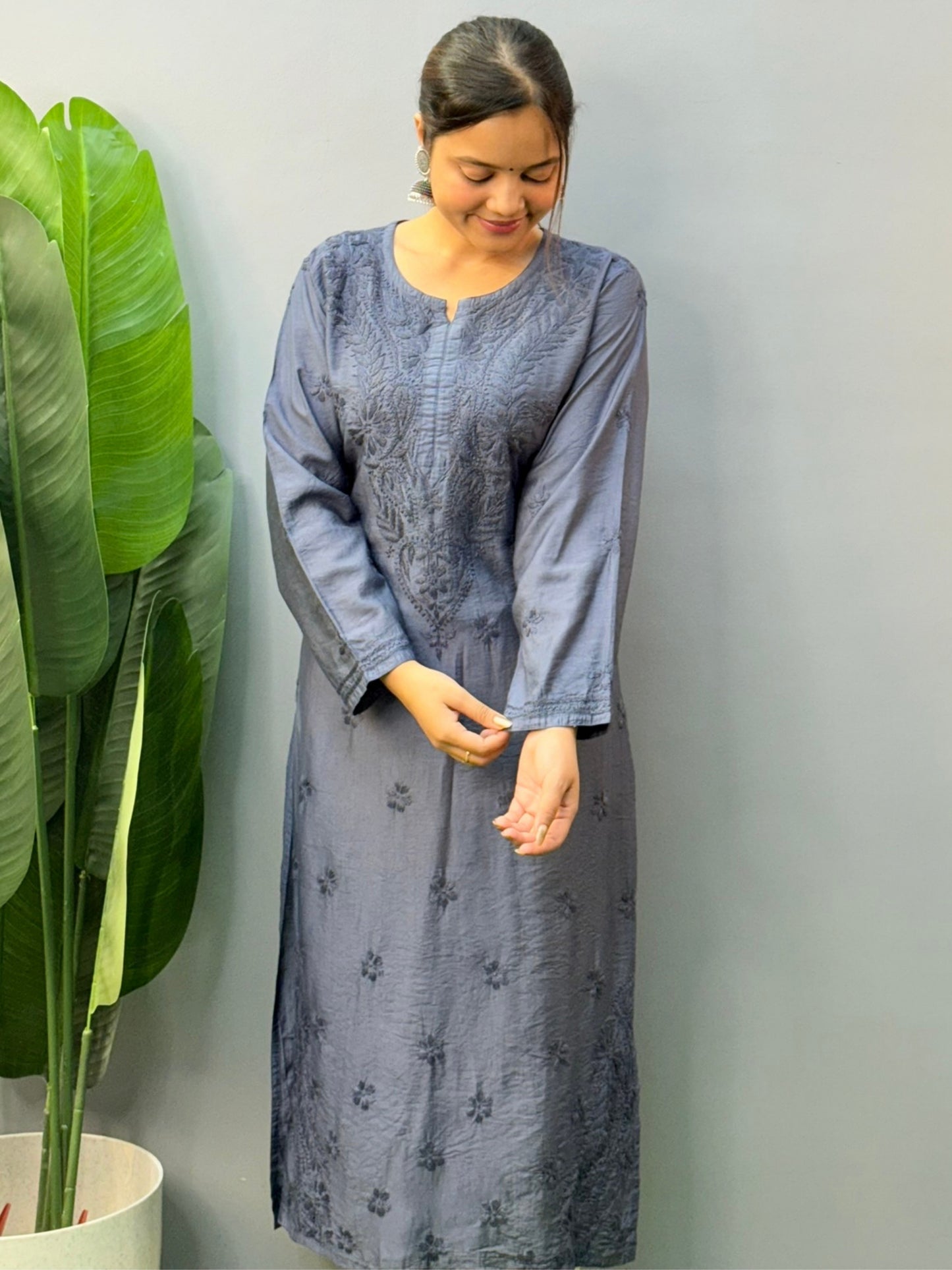 Model wearing steel grey hand-embroidered Chanderi chikankari kurta with delicate motifs