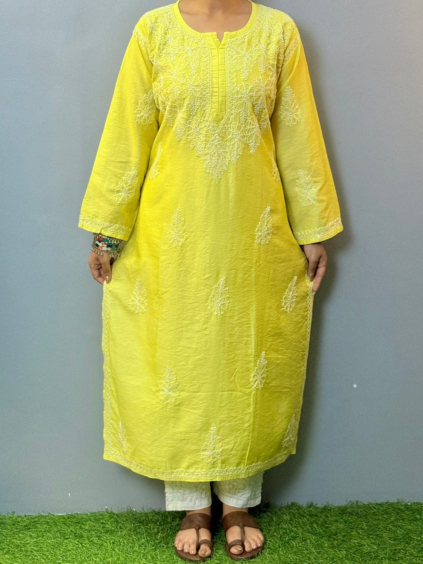 Woman wearing lime yellow chanderi chikankari kurta with bakhiya embroidery