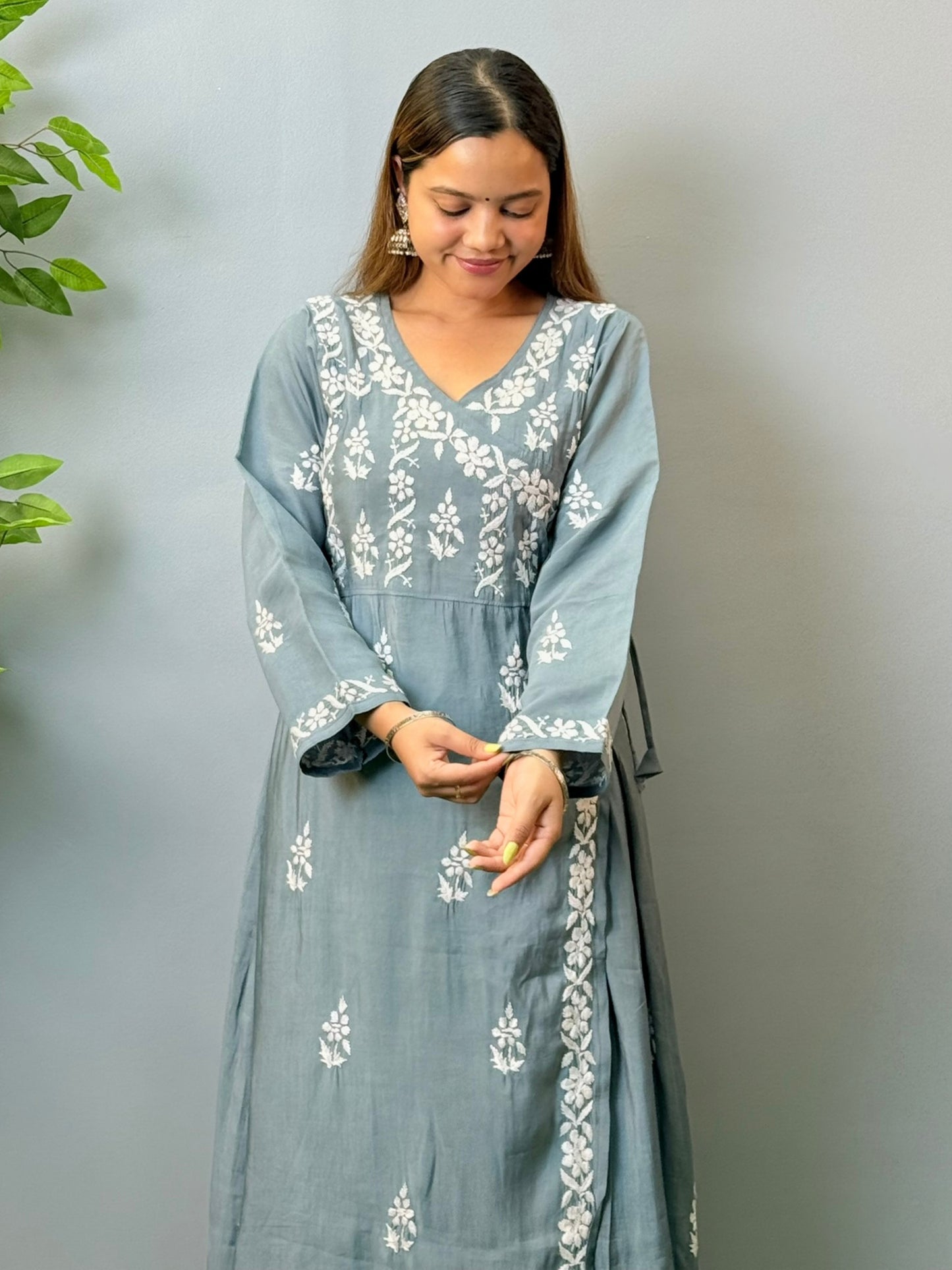 Model wearing grey angrakha-style Chikankari kurta with white hand embroidery