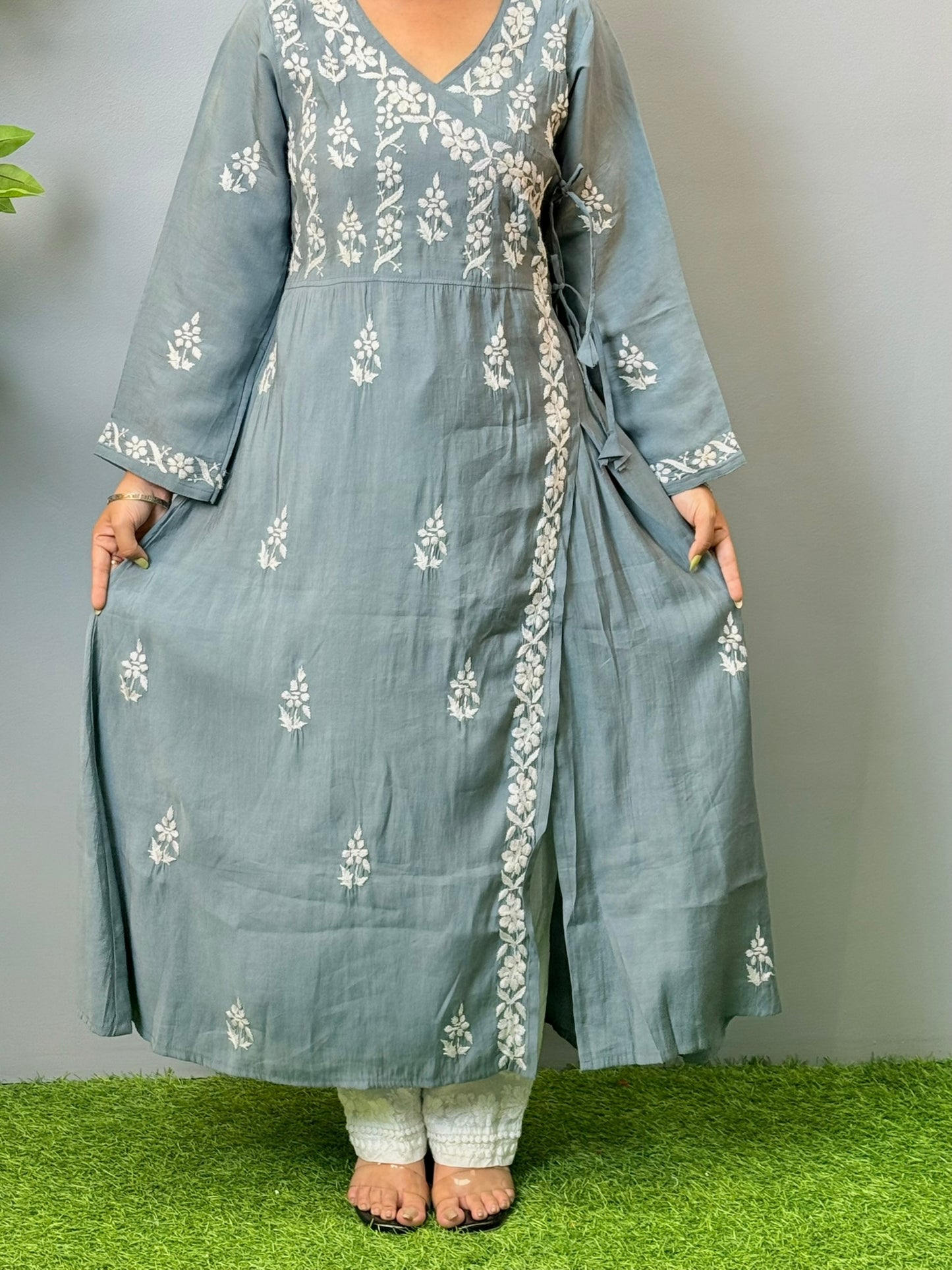 Model wearing grey angrakha-style Chikankari kurta with white hand embroidery