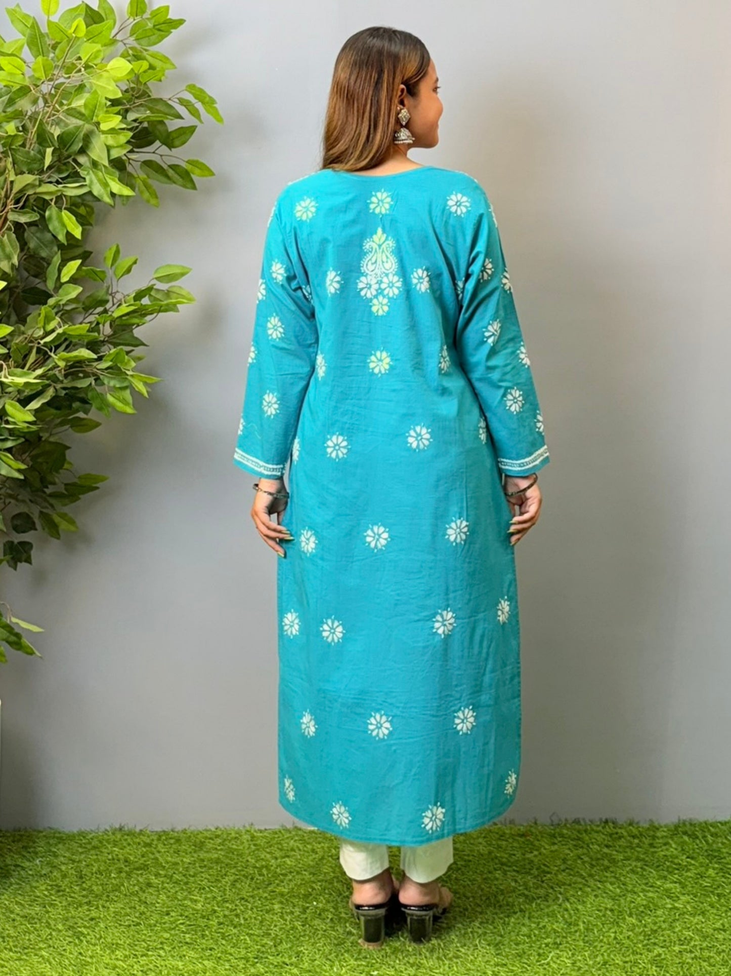 Woman in turquoise blue cotton chikankari kurta with white embroidery