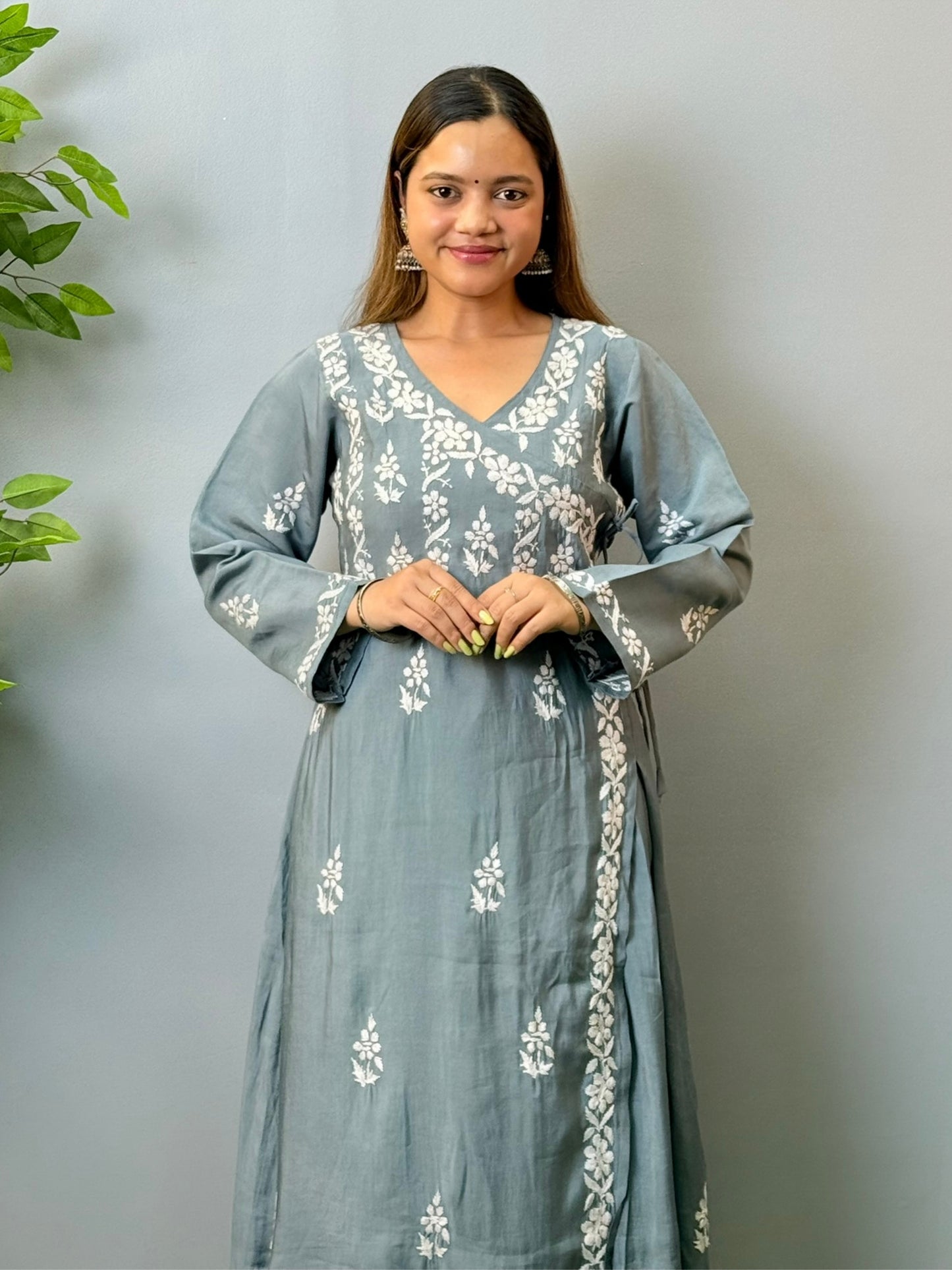 Model wearing grey angrakha-style Chikankari kurta with white hand embroidery