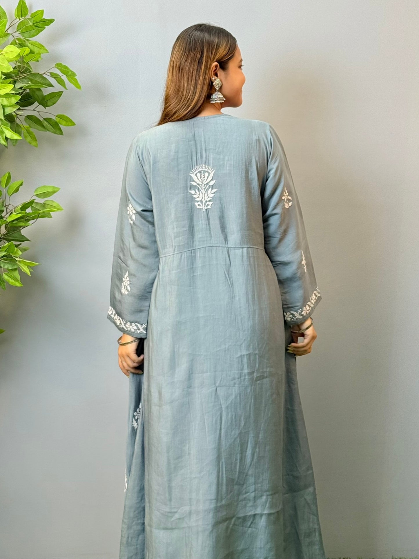 Model wearing grey angrakha-style Chikankari kurta with white hand embroidery