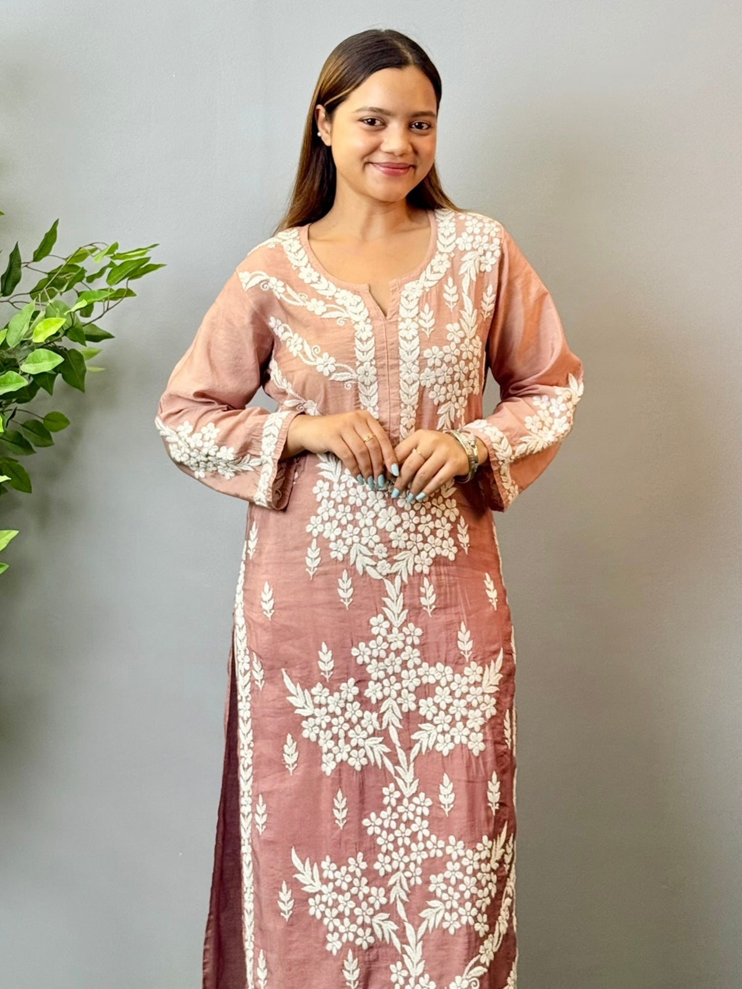 Model in dusty rose Chanderi Lucknowi chikankari kurta featuring intricate 3D white hand embroidery