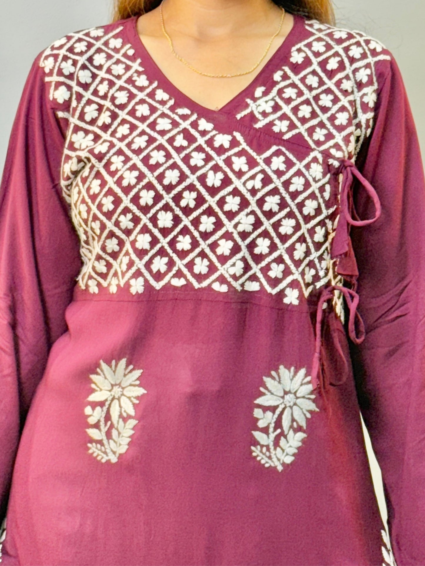 Wine color angrakha-style Lucknow Chikankari kurta with white floral embroidery and side tie-ups