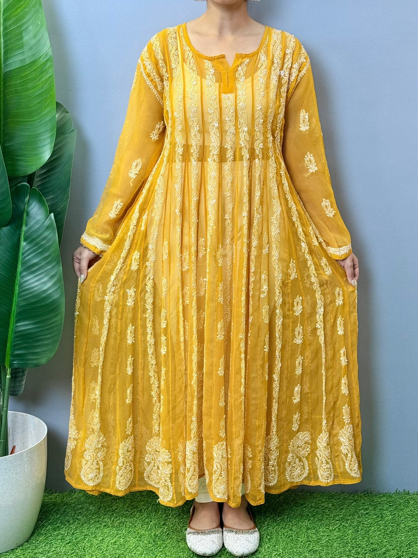 Sunshine yellow georgette long frock with heavy flair and white Lucknowi Chikankari embroidery – festive ethnic wear
