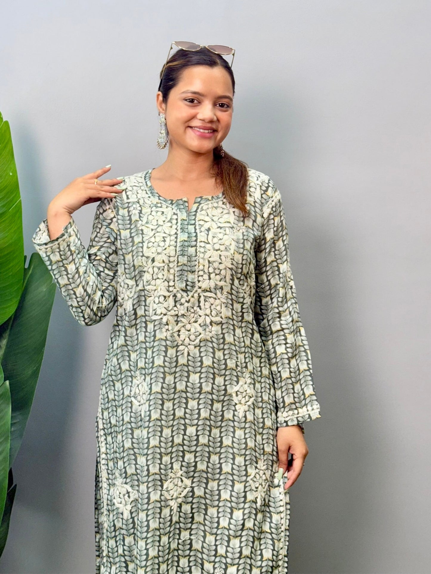 Model wearing olive grey printed chikankari kurta in mulmul fabric with white hand embroidery