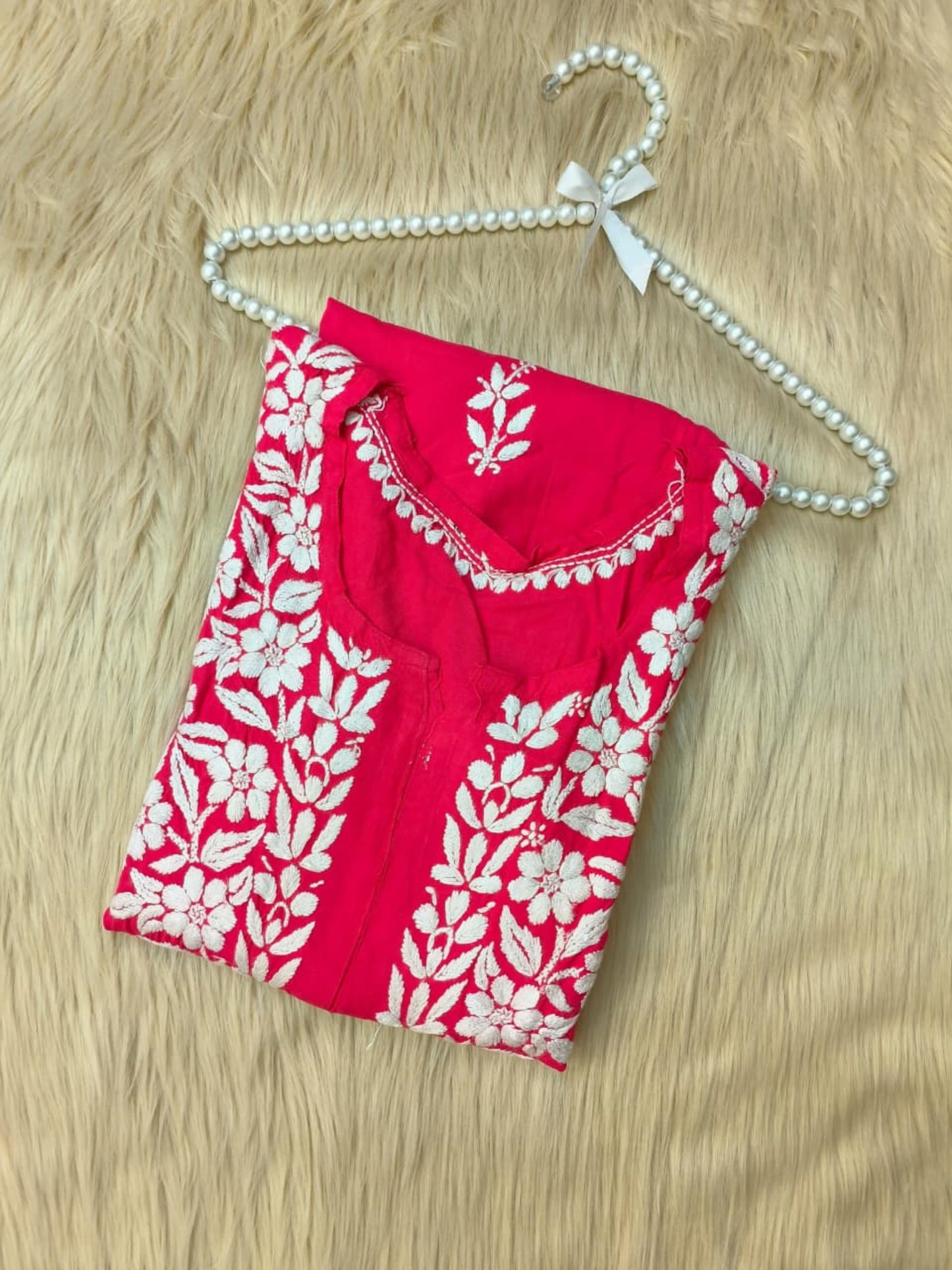 Rani pink rayon Lucknow Chikankari kurta with white hand embroidery, soft and comfortable.