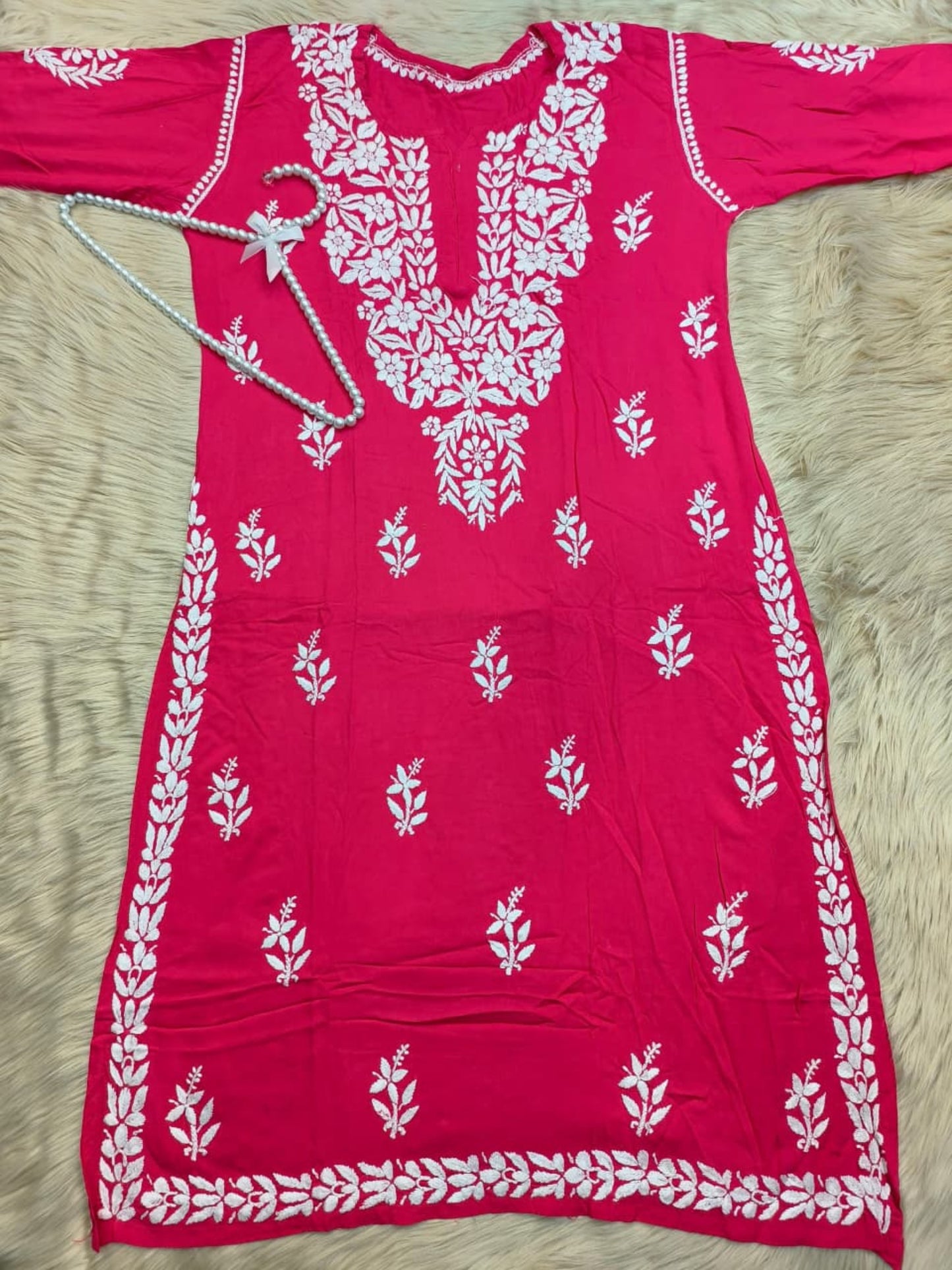 Rani pink rayon Lucknow Chikankari kurta with white hand embroidery, soft and comfortable.