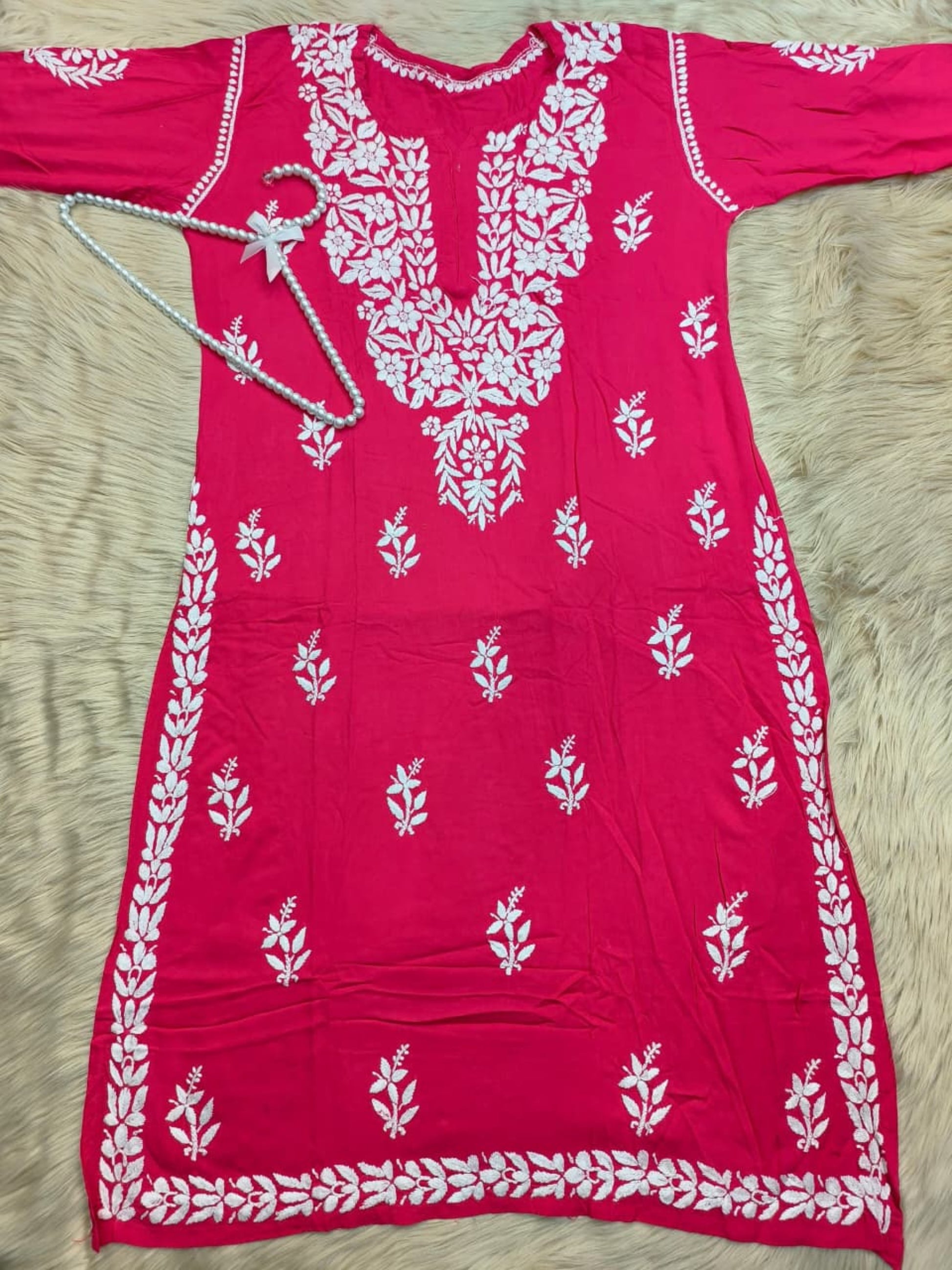 Rani pink rayon Lucknow Chikankari kurta with white hand embroidery, soft and comfortable.