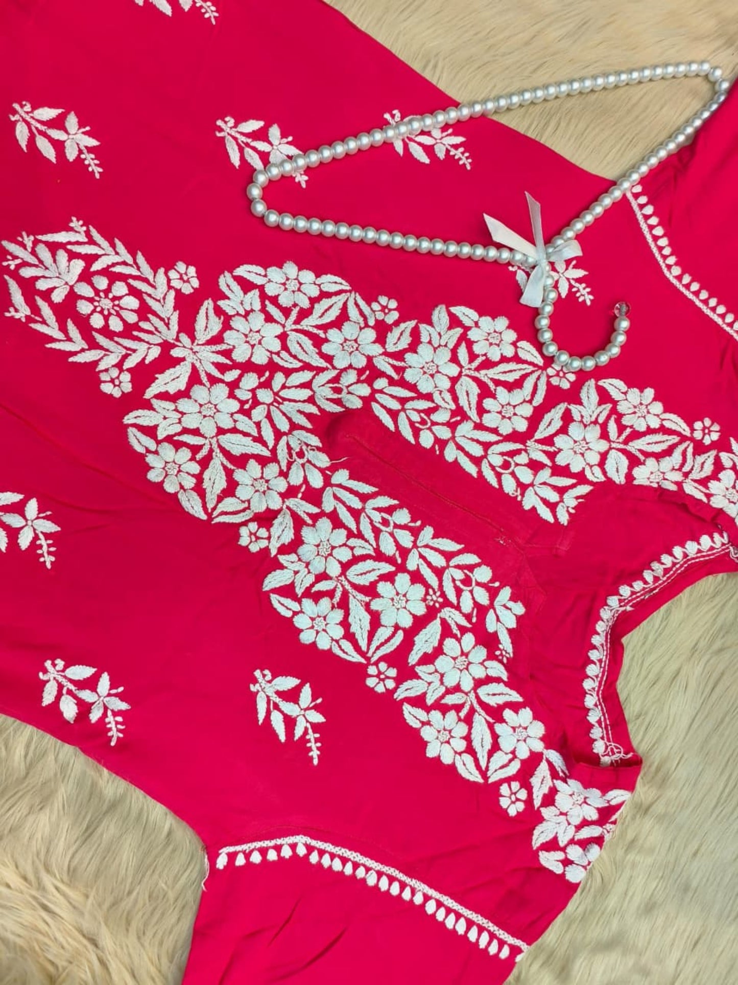 Rani pink rayon Lucknow Chikankari kurta with white hand embroidery, soft and comfortable.