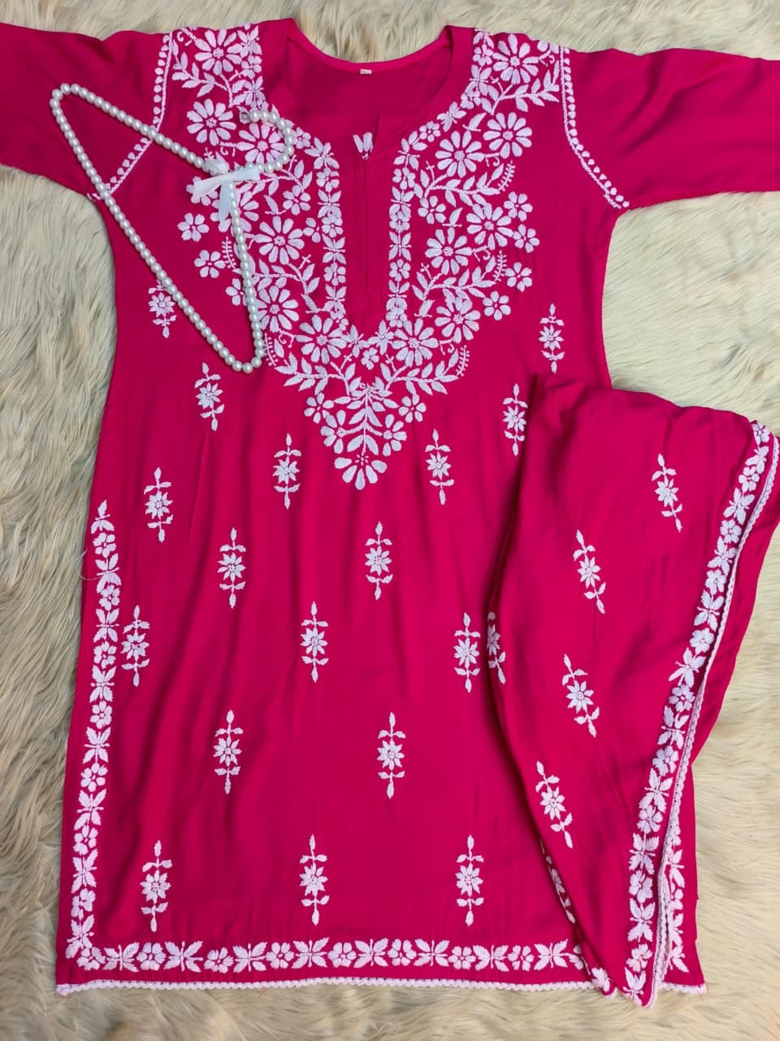 Rani pink rayon Lucknow Chikankari kurta with matching dhoti set, hand-embroidered and premium quality.