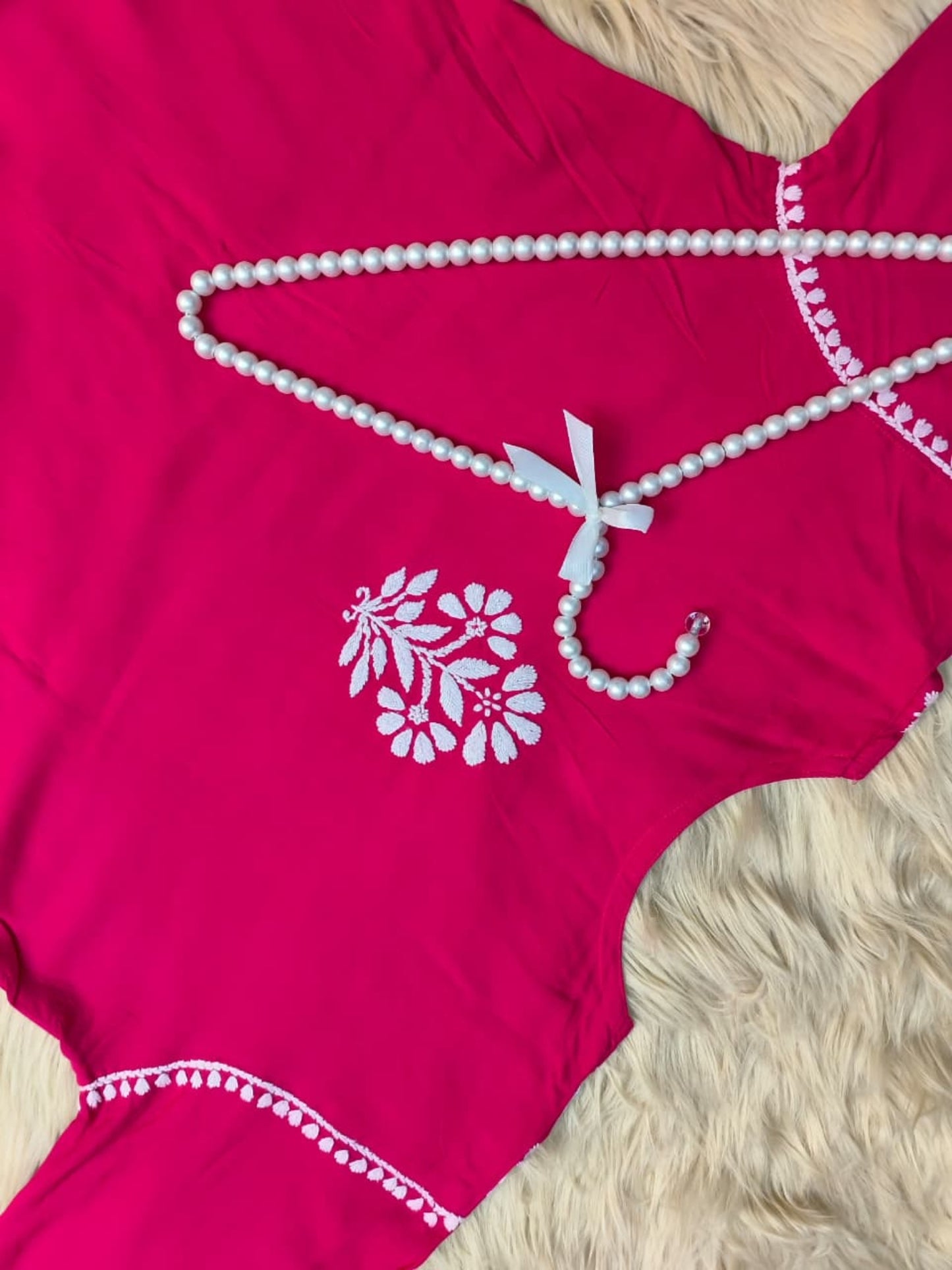 Rani pink rayon Lucknow Chikankari kurta with matching dhoti set, hand-embroidered and premium quality.