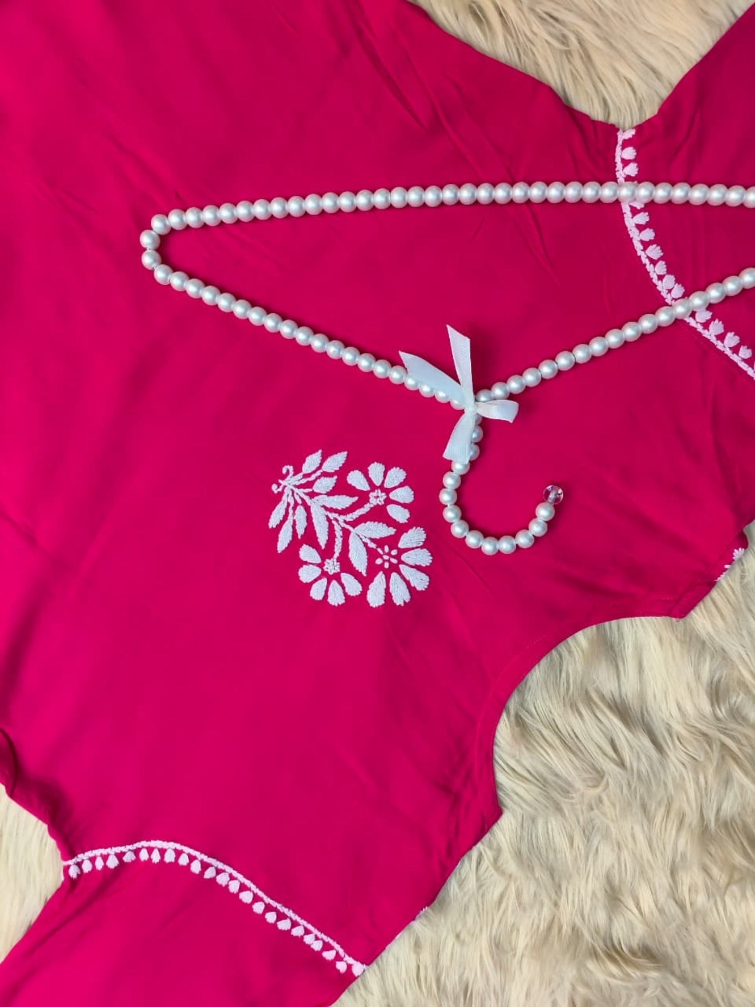 Rani pink rayon Lucknow Chikankari kurta with matching dhoti set, hand-embroidered and premium quality.