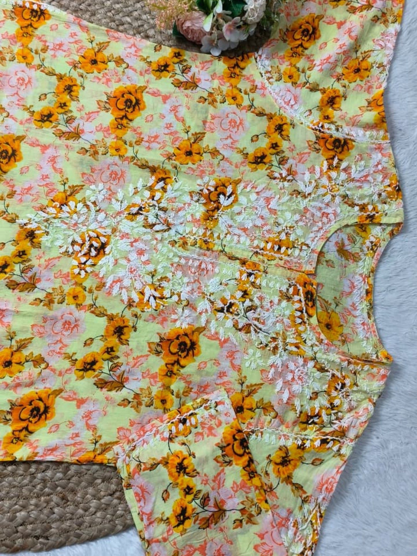 Lucknow Chikankari yellow printed mulmul kurta with floral design and hand embroidery.