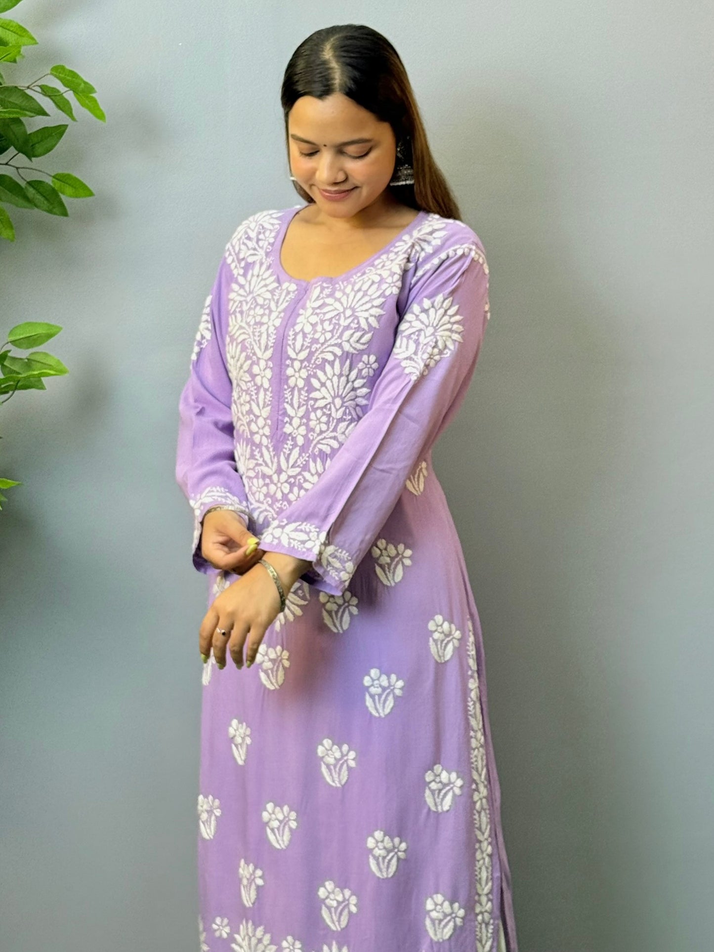 Woman wearing orchid purple rayon chikankari kurta with white embroidery