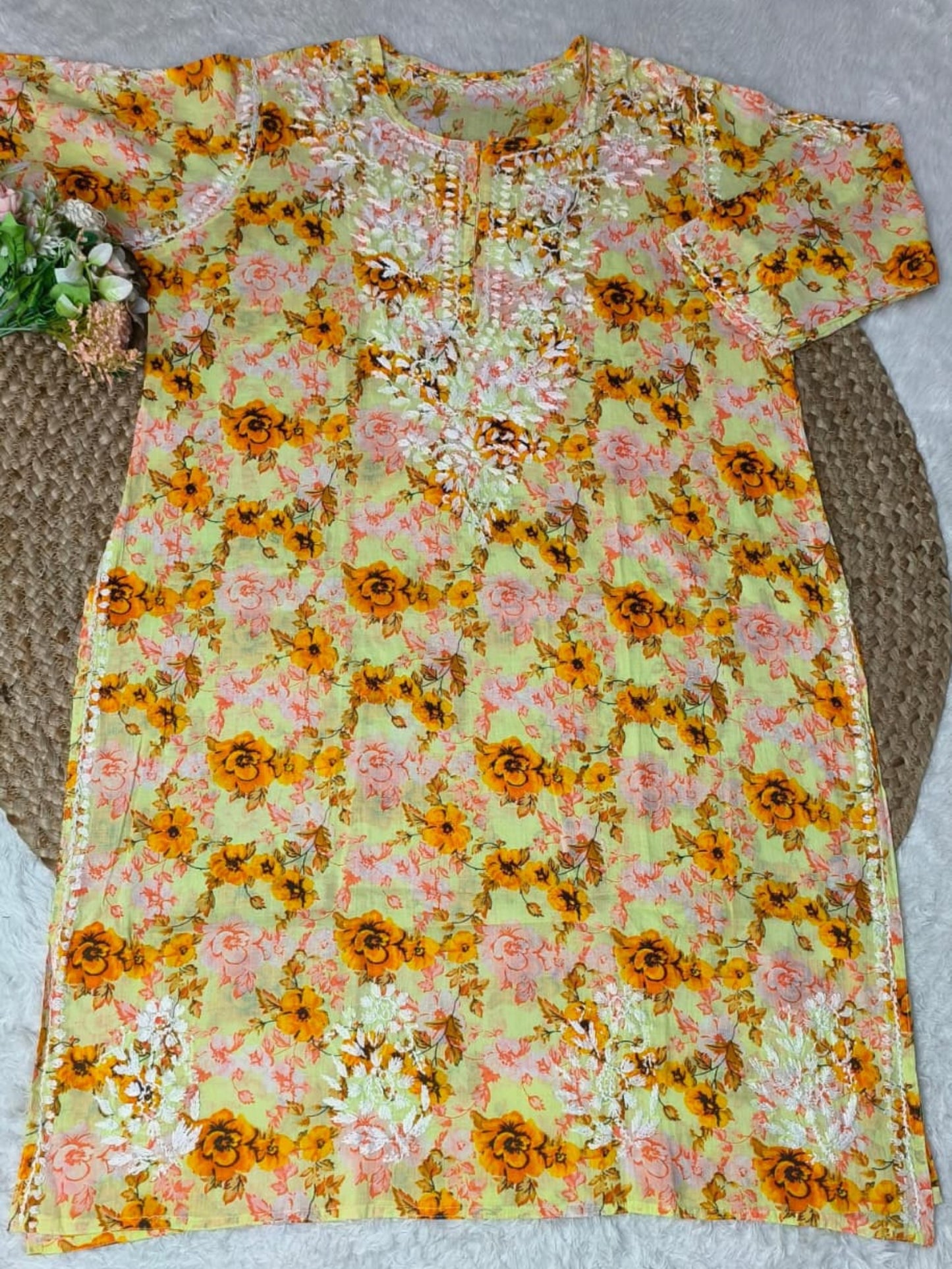 Lucknow Chikankari yellow printed mulmul kurta with floral design and hand embroidery.