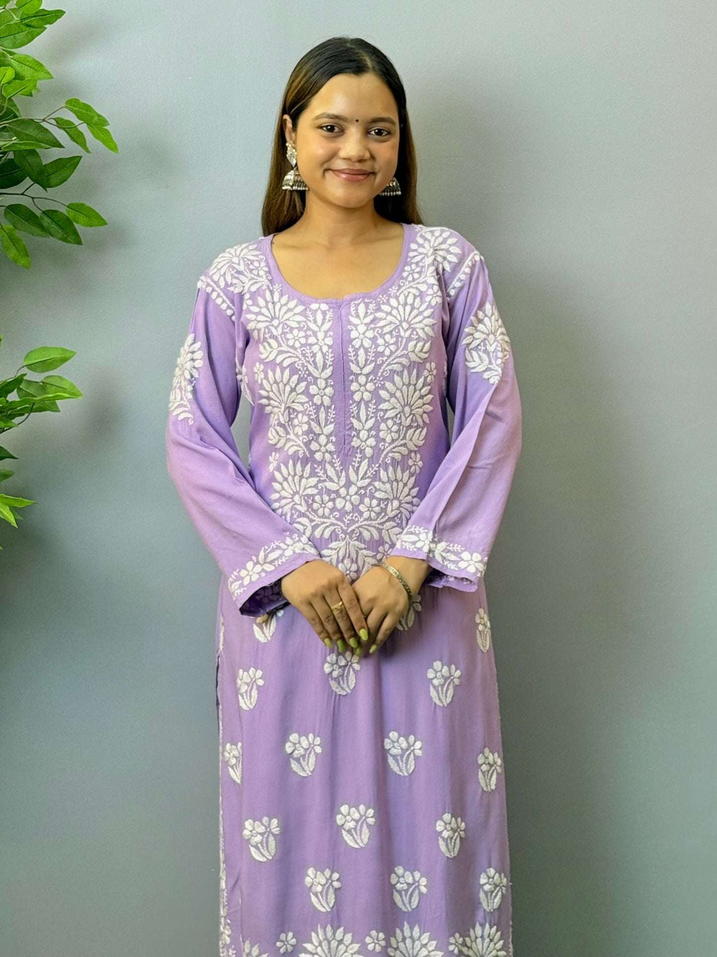 Woman wearing orchid purple rayon chikankari kurta with white embroidery