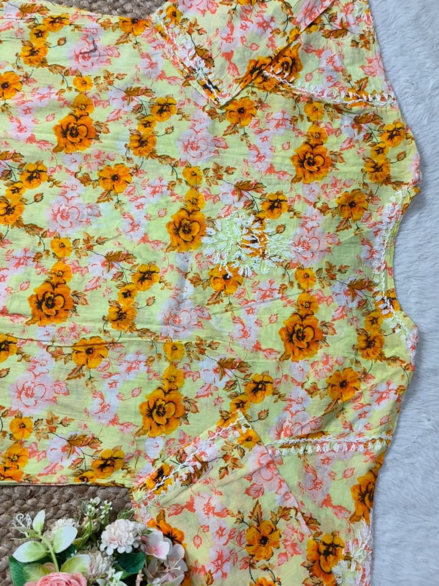 Lucknow Chikankari yellow printed mulmul kurta with floral design and hand embroidery.