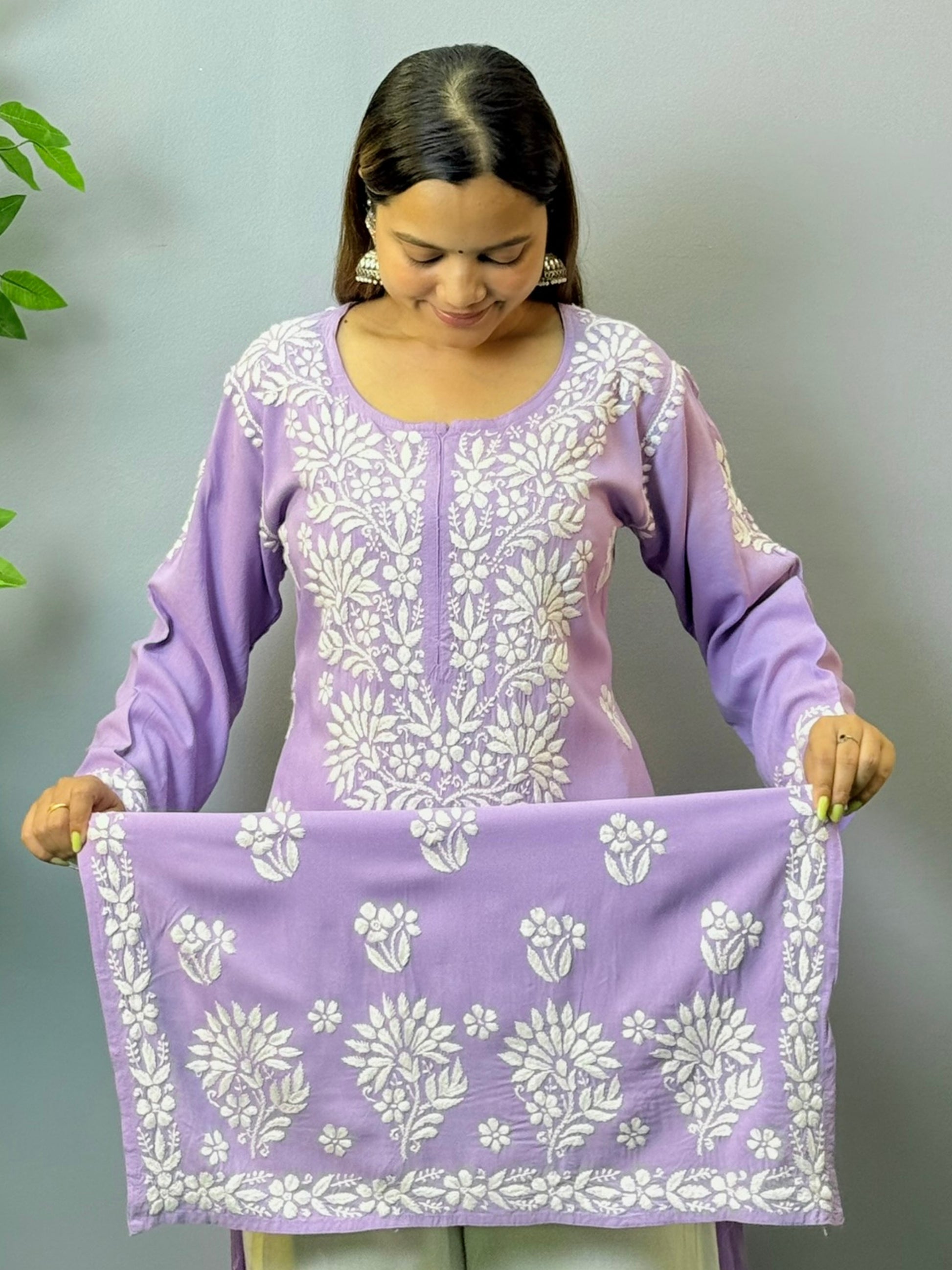 Woman wearing orchid purple rayon chikankari kurta with white embroidery