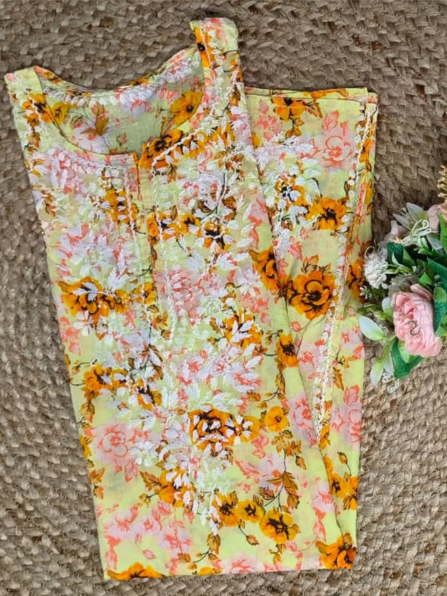Lucknow Chikankari yellow printed mulmul kurta with floral design and hand embroidery.