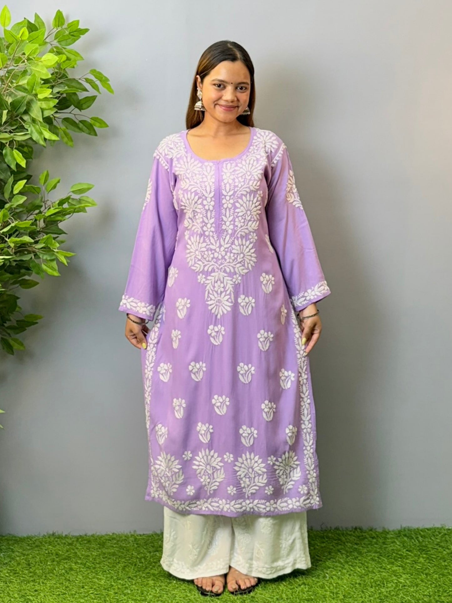 Woman wearing orchid purple rayon chikankari kurta with white embroidery