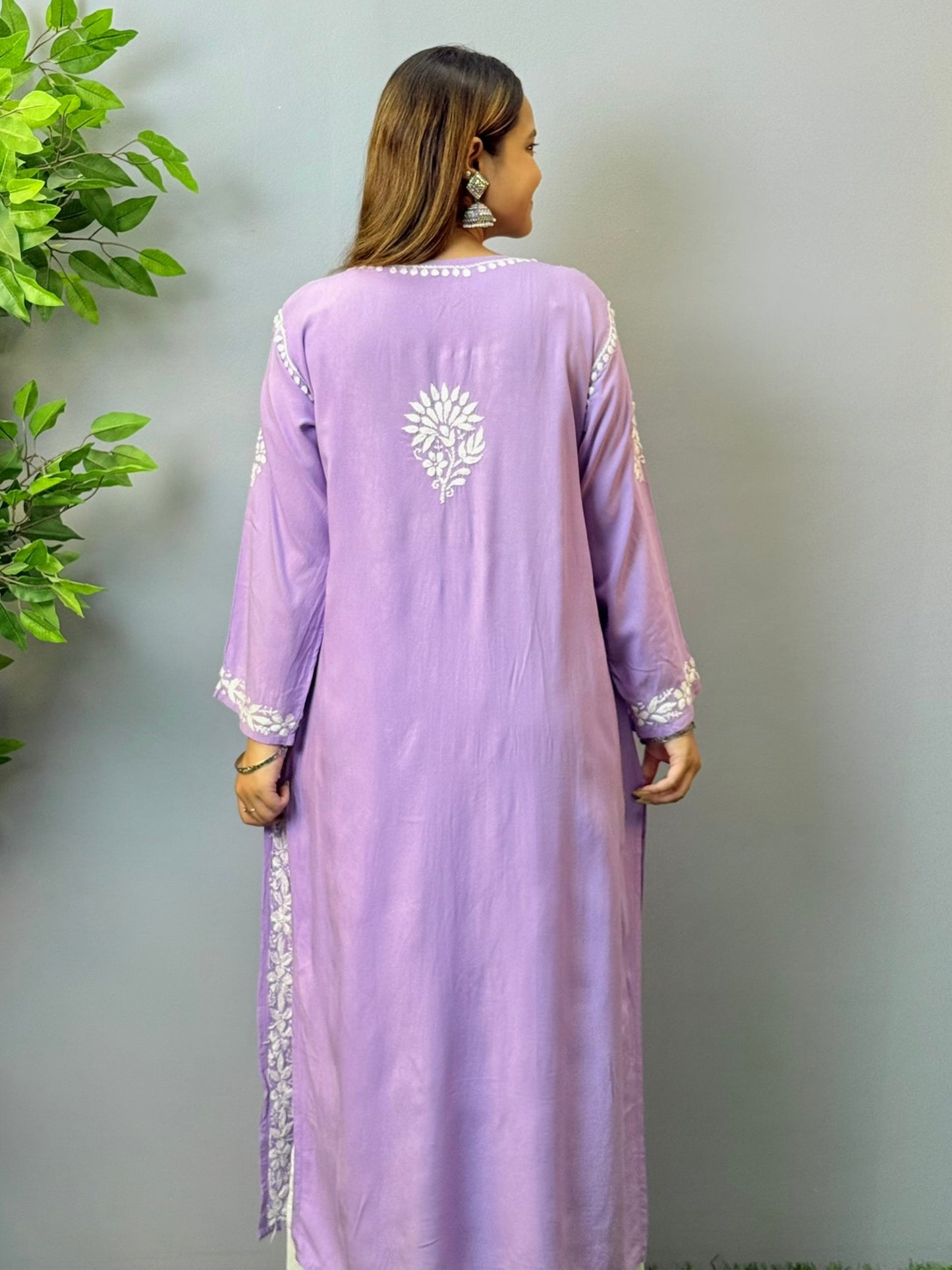 Woman wearing orchid purple rayon chikankari kurta with white embroidery