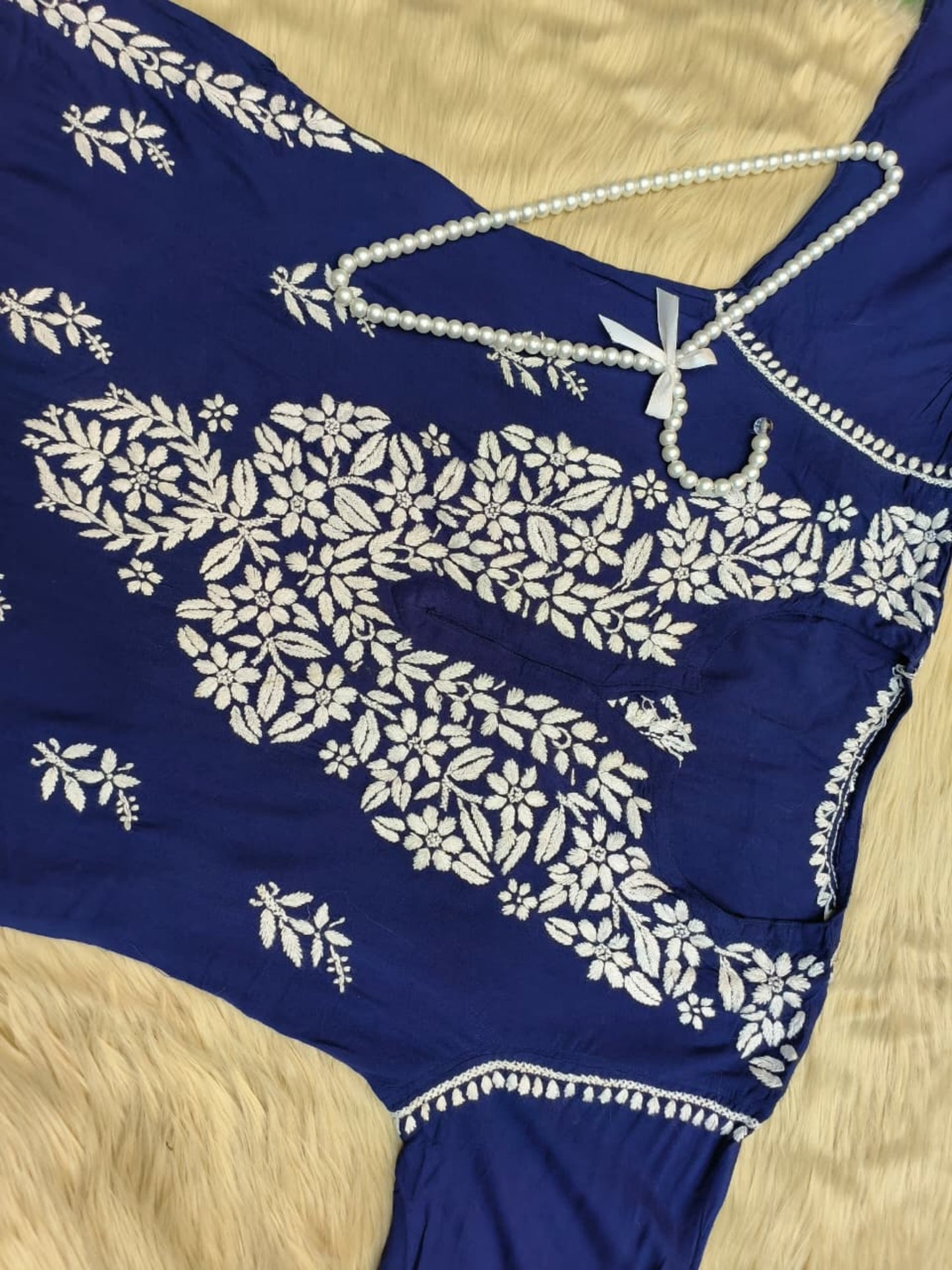 Navy blue rayon Lucknowi Chikankari kurta with hand embroidery in floral and paisley patterns.