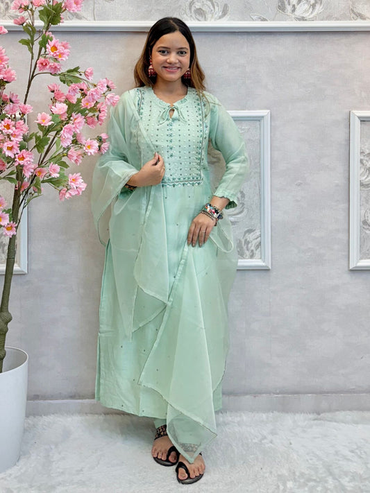 Model wearing a mint green chanderi hand-embroidered kurta set with organza dupatta – Designer Wear Collection.