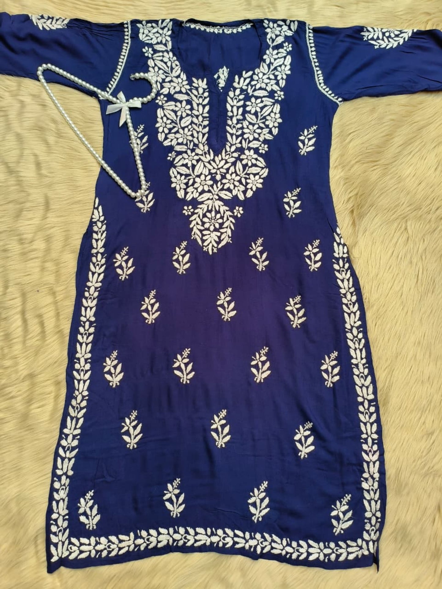 Navy blue rayon Lucknowi Chikankari kurta with hand embroidery in floral and paisley patterns.