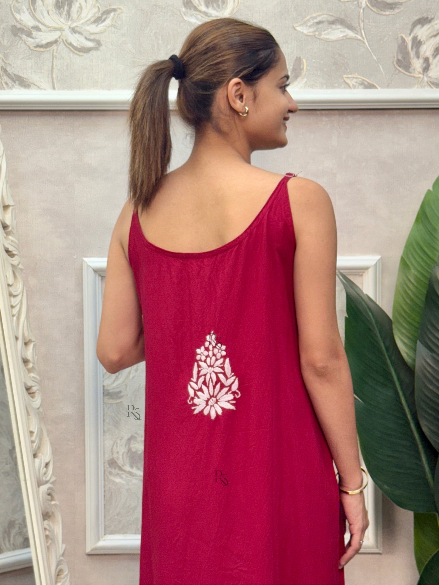 Deep maroon sleeveless Lucknow Chikankari rayon kurta and pant set with white hand embroidery.