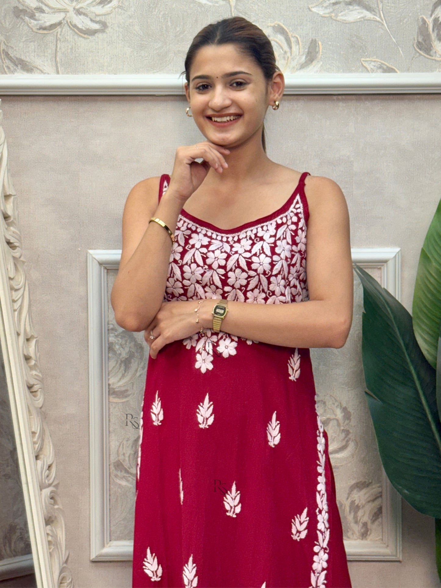 Deep maroon sleeveless Lucknow Chikankari rayon kurta and pant set with white hand embroidery.