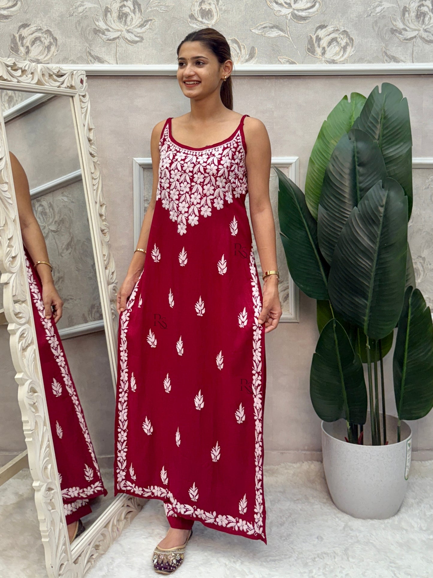 Deep maroon sleeveless Lucknow Chikankari rayon kurta and pant set with white hand embroidery.