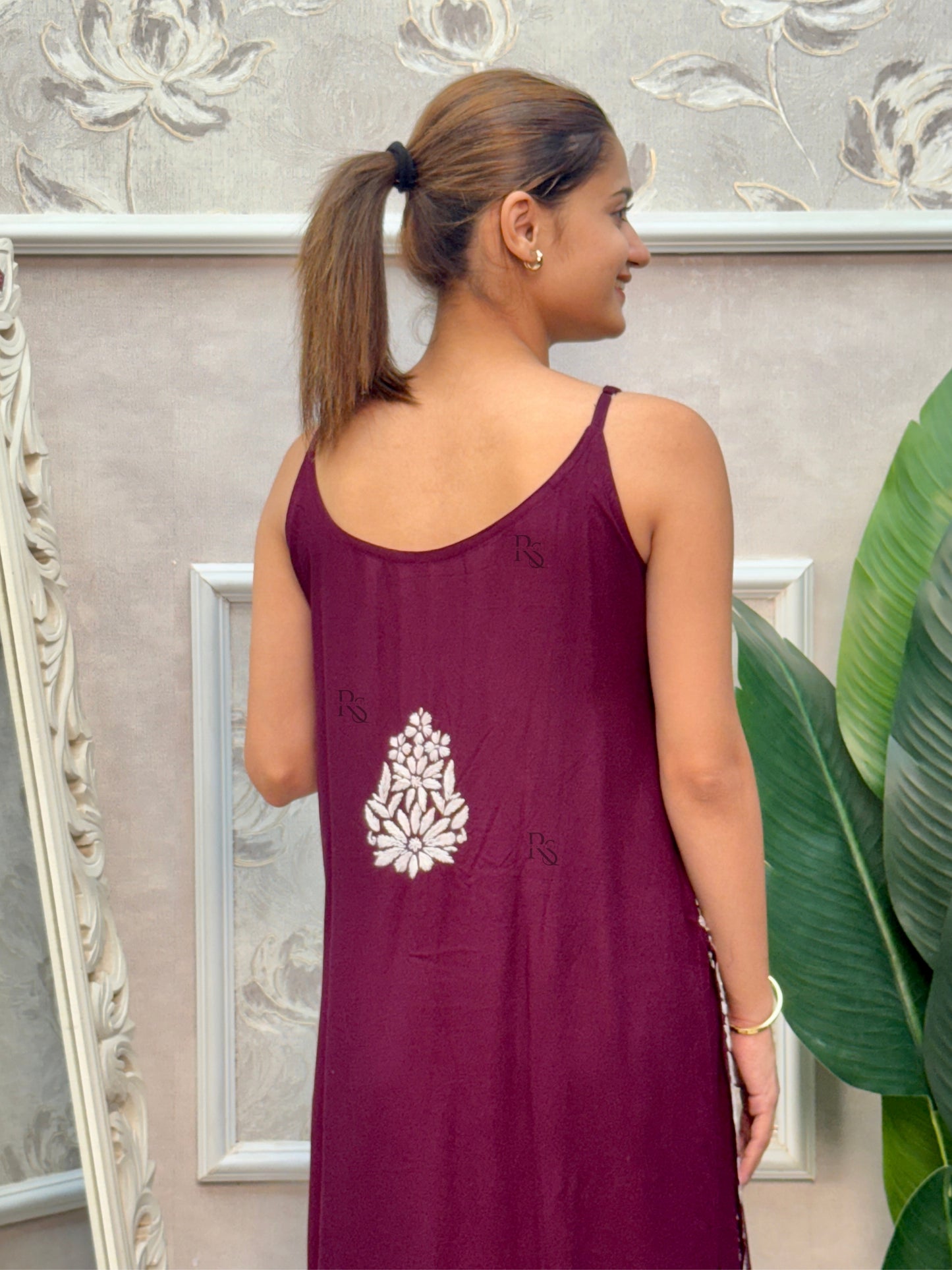 Wine sleeveless Lucknow Chikankari rayon kurta and pant set with white hand embroidery.