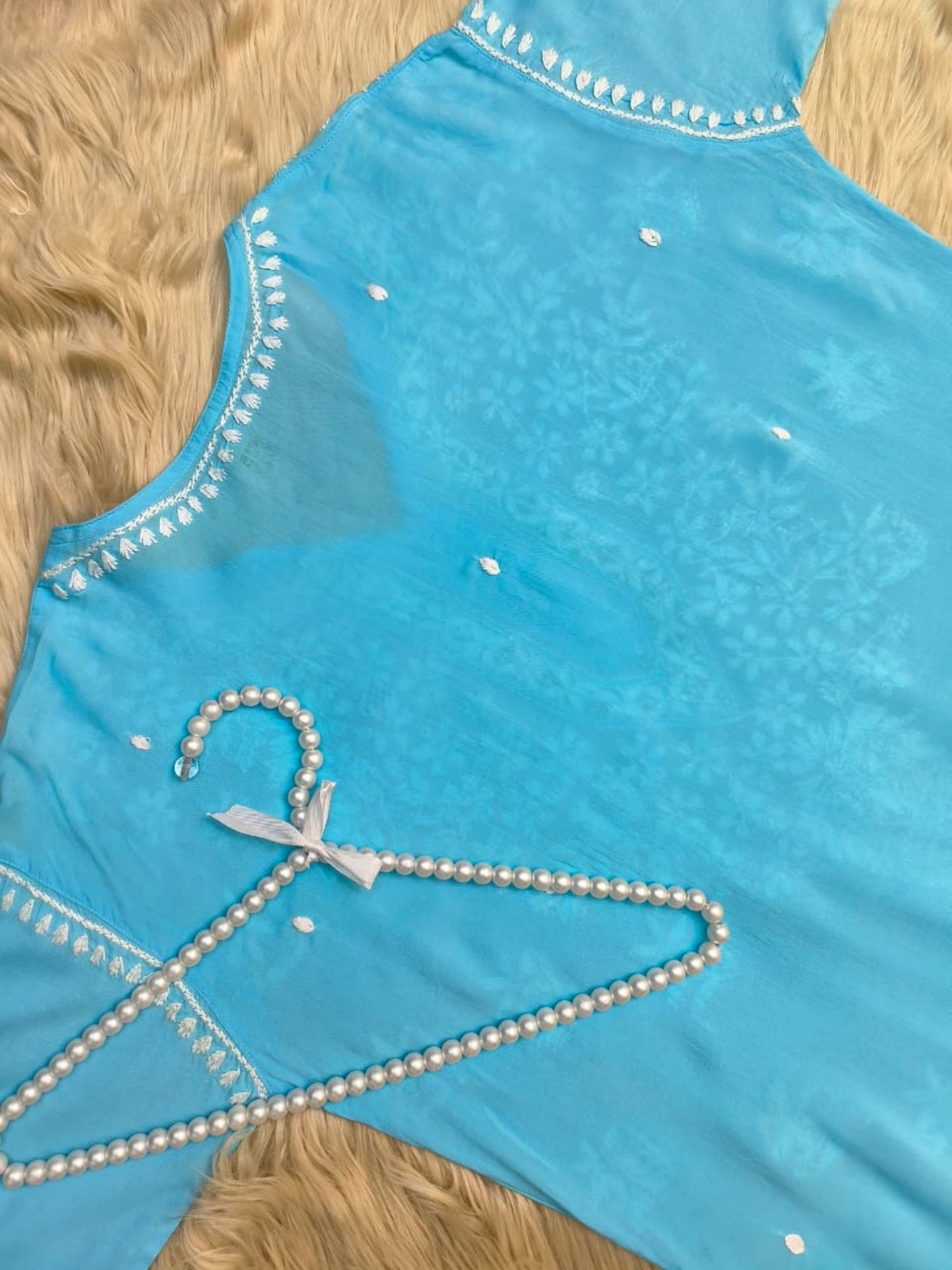 Aqua blue modal Lucknow Chikankari kurta with white hand embroidery, premium quality.