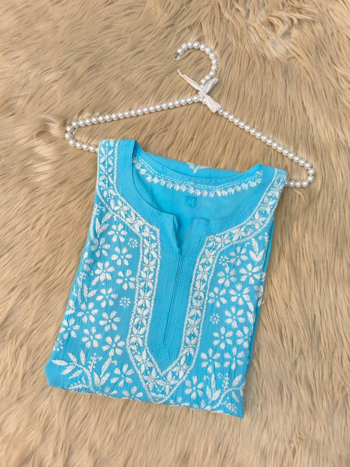Aqua blue modal Lucknow Chikankari kurta with white hand embroidery, premium quality.