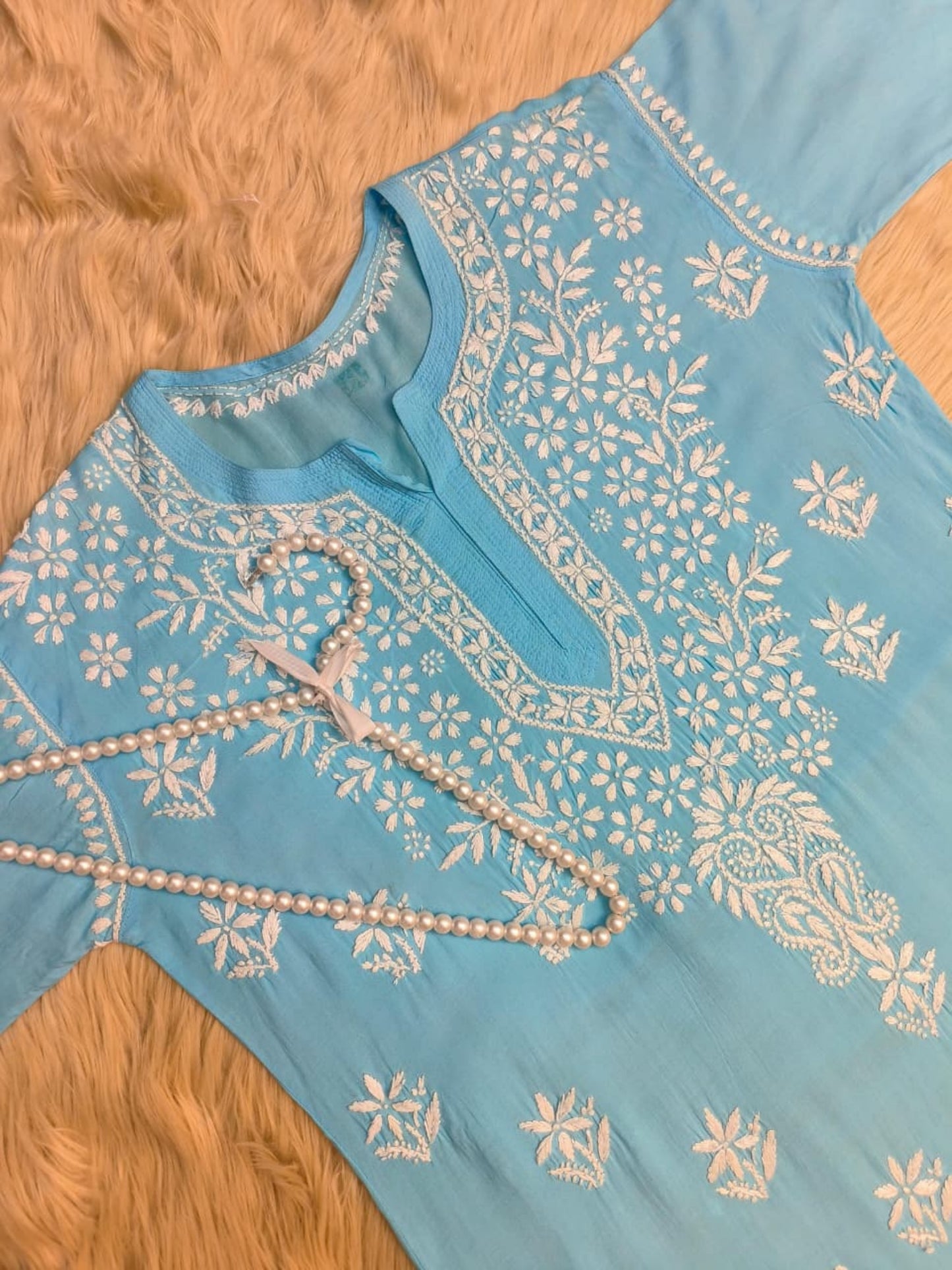 Aqua blue modal Lucknow Chikankari kurta with white hand embroidery, premium quality.