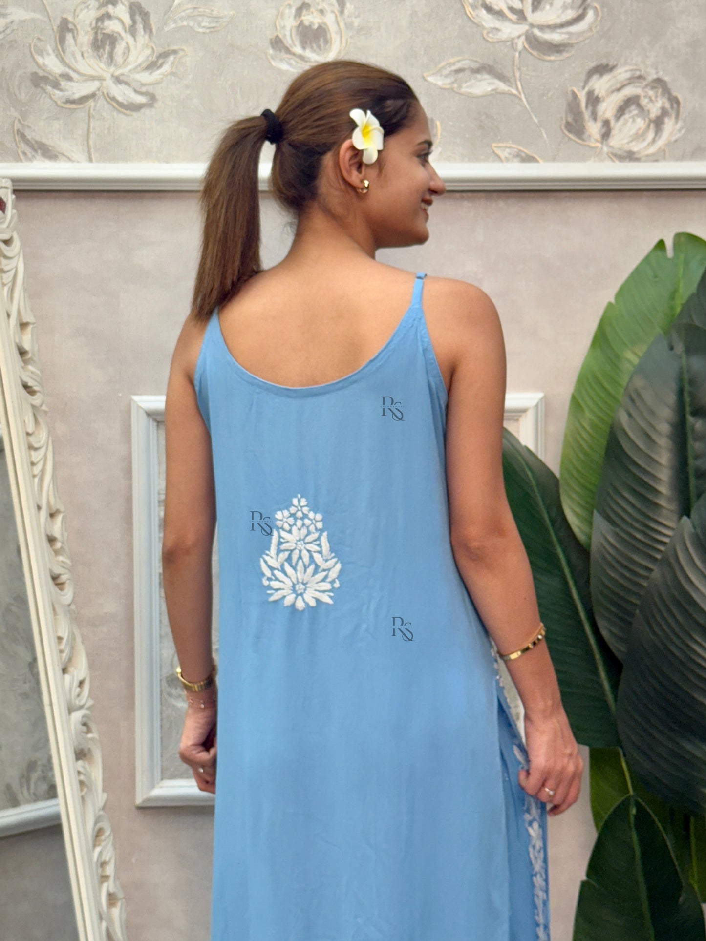 Sky blue sleeveless Lucknow Chikankari rayon kurta and pant set with white hand embroidery.