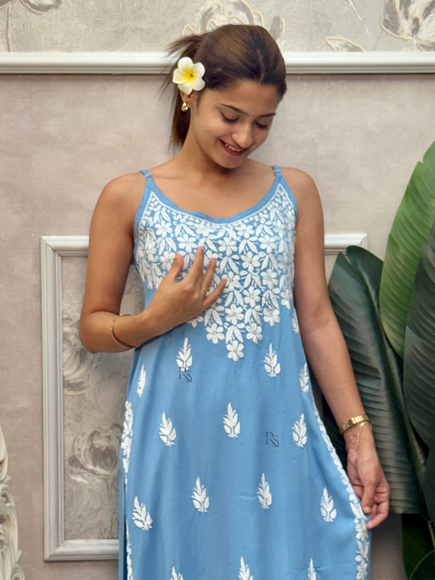 Sky blue sleeveless Lucknow Chikankari rayon kurta and pant set with white hand embroidery.