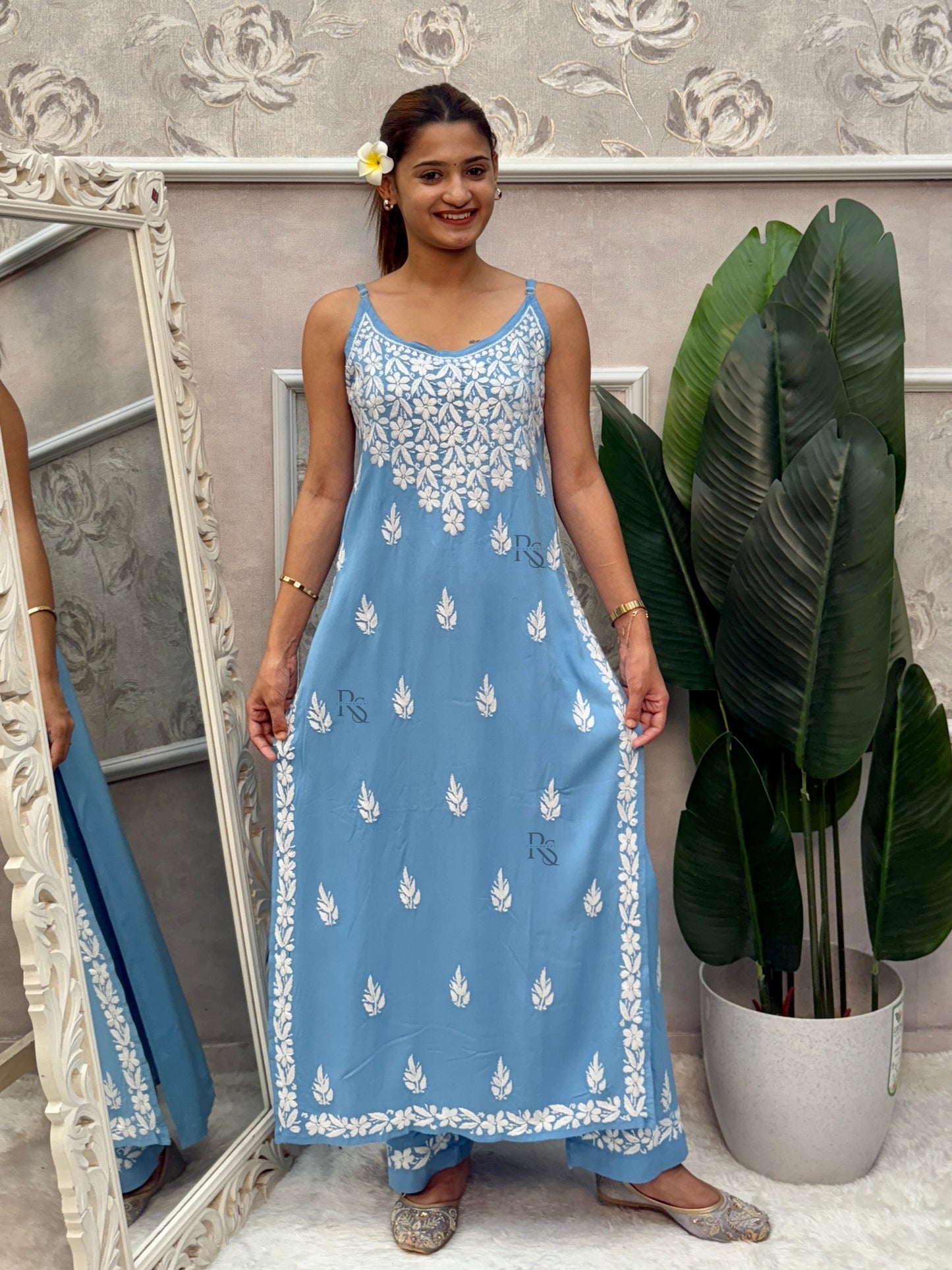 Sky blue sleeveless Lucknow Chikankari rayon kurta and pant set with white hand embroidery.