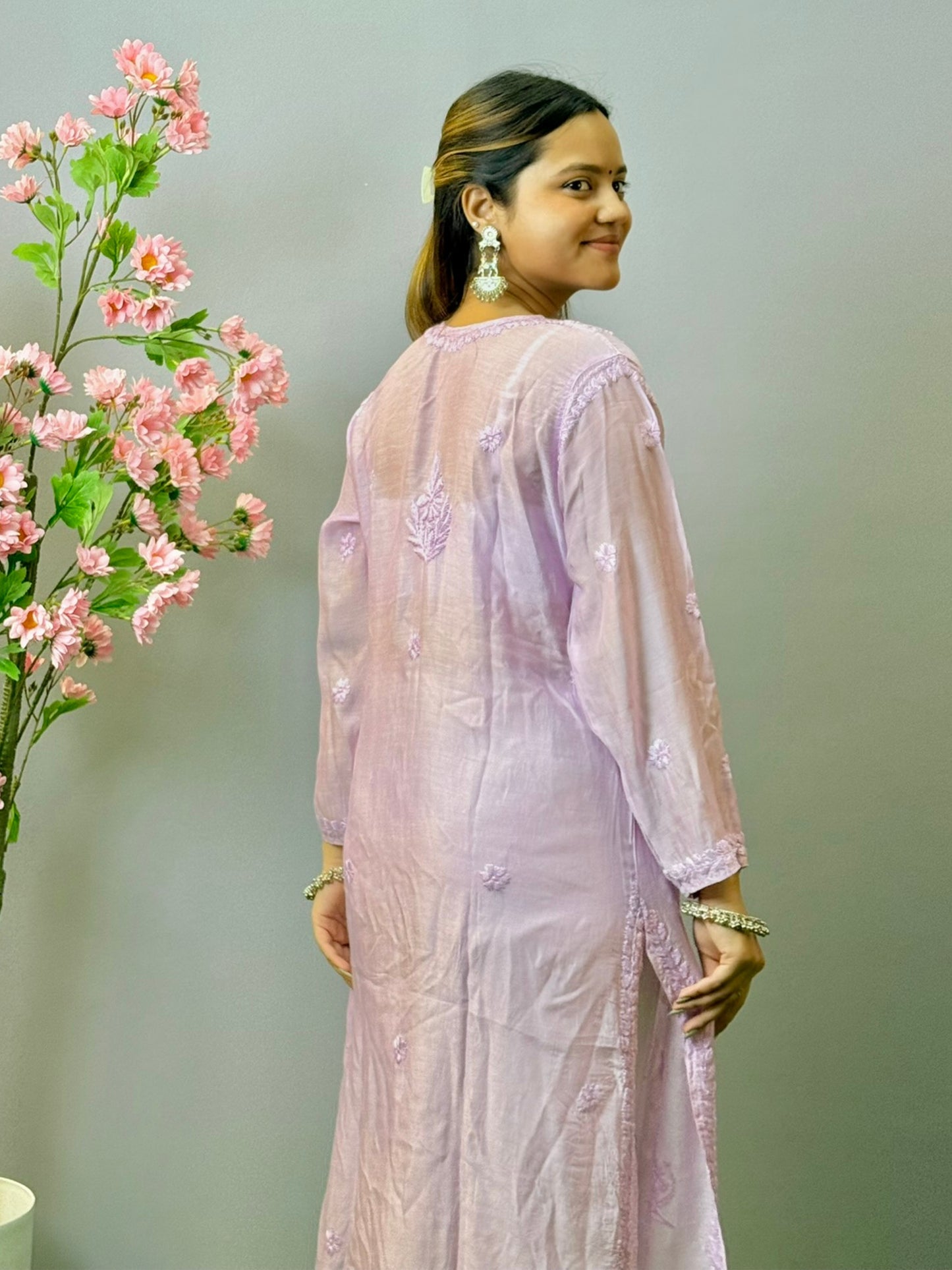 Woman wearing lilac muslin Lucknow chikankari kurta with hand embroidery