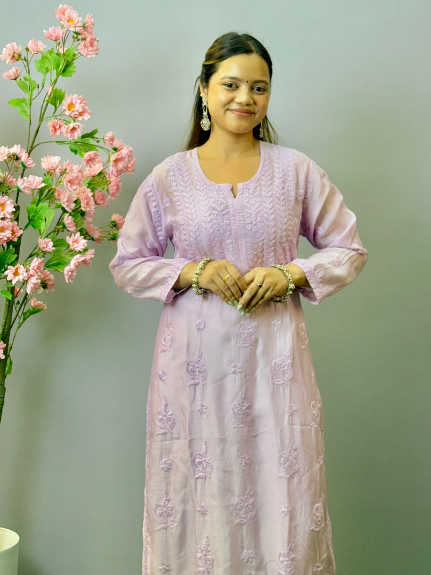 Woman wearing lilac muslin Lucknow chikankari kurta with hand embroidery