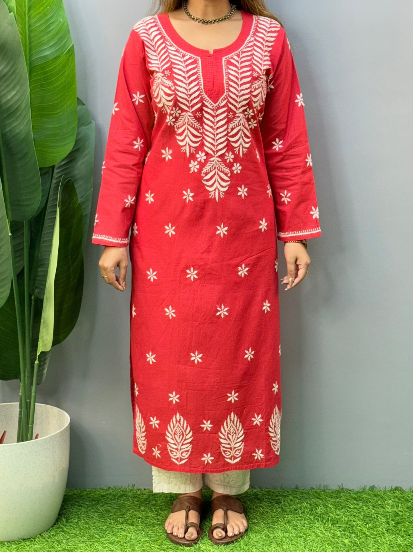 Model wearing a premium red cotton Lucknowi chikankari kurta with white hand embroidery