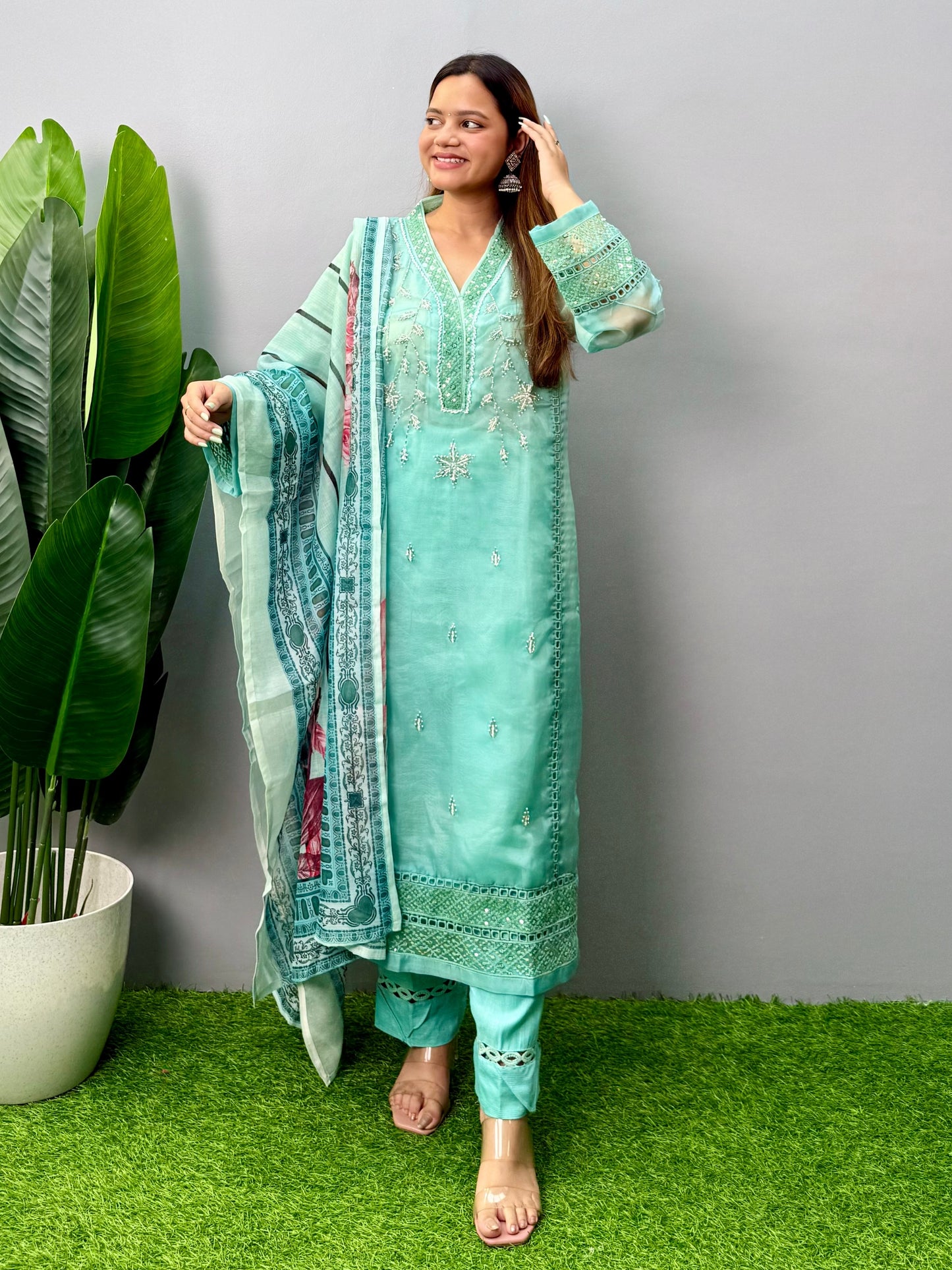 Model wearing a mint green organza kurta with rayon pants and printed cotton dupatta – Designer Wear Collection.