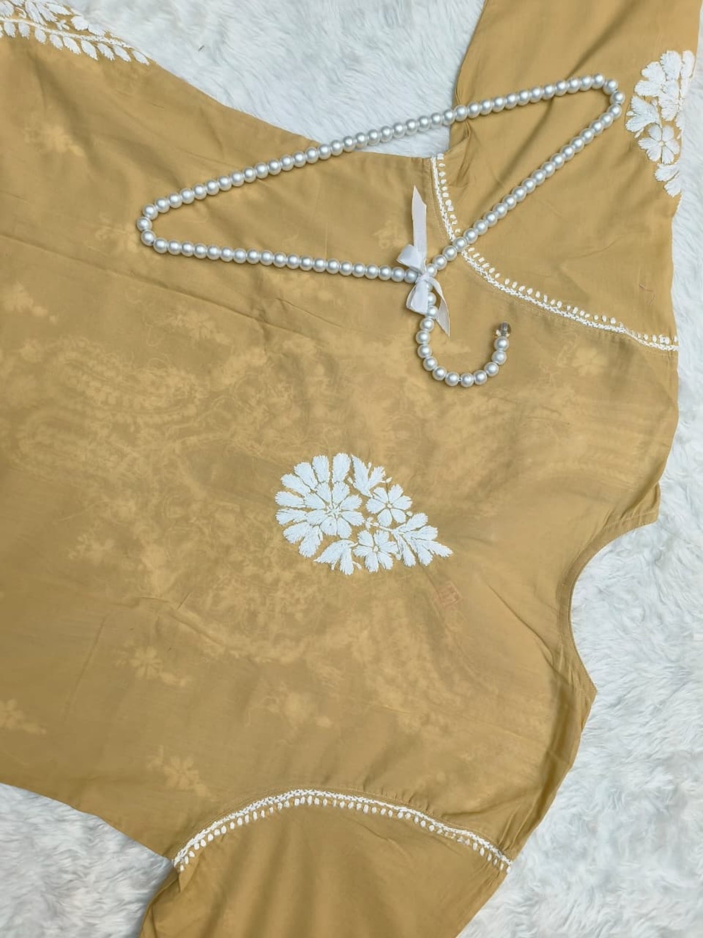 Camel brown cotton Lucknow Chikankari kurta with matching palazzo set, hand-embroidered in white thread.